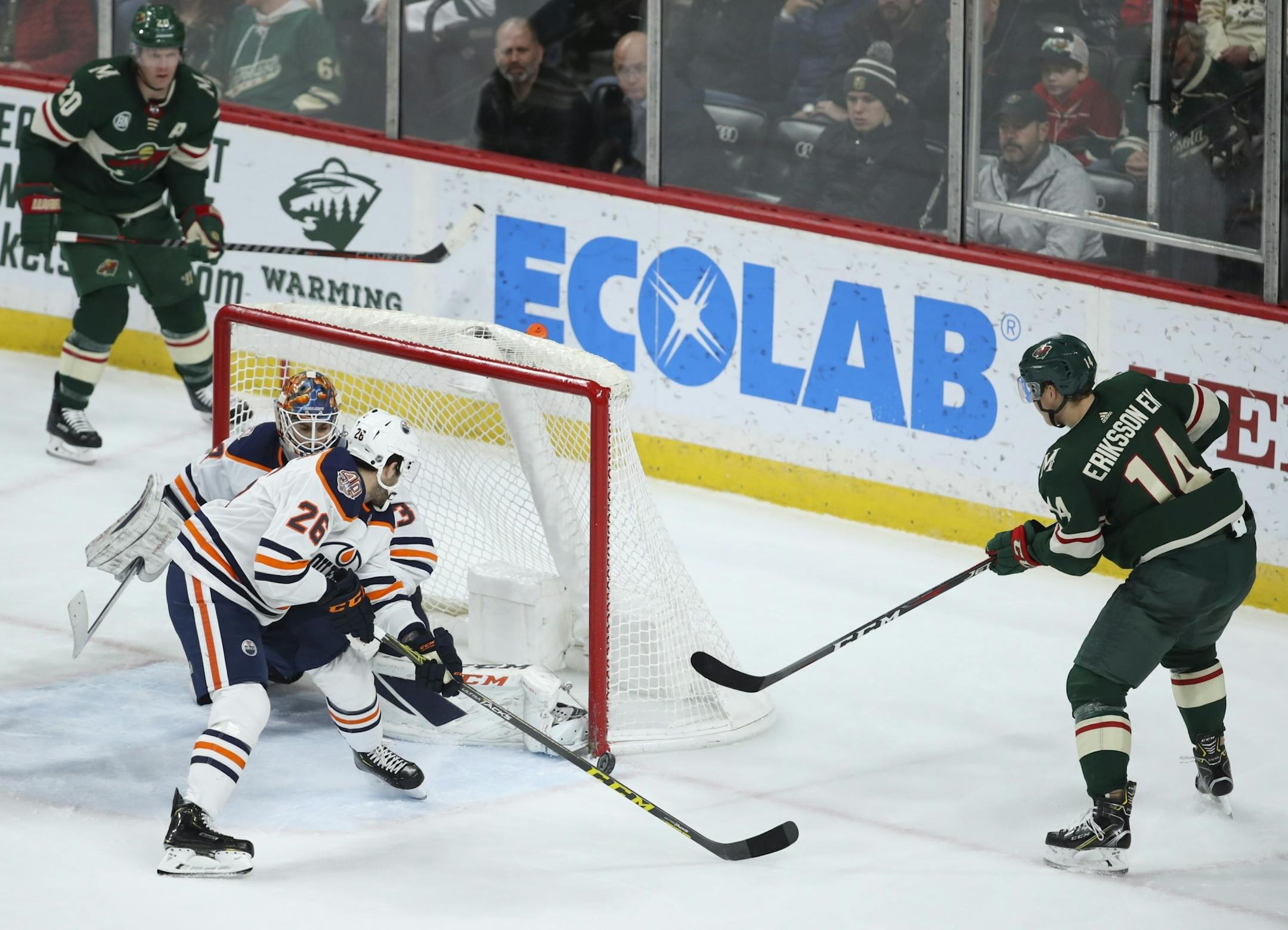Edmonton Oilers goaltender Cam Talbot (33) stopped a third period shot by the Wild's Joel Ericksson Ek (14).