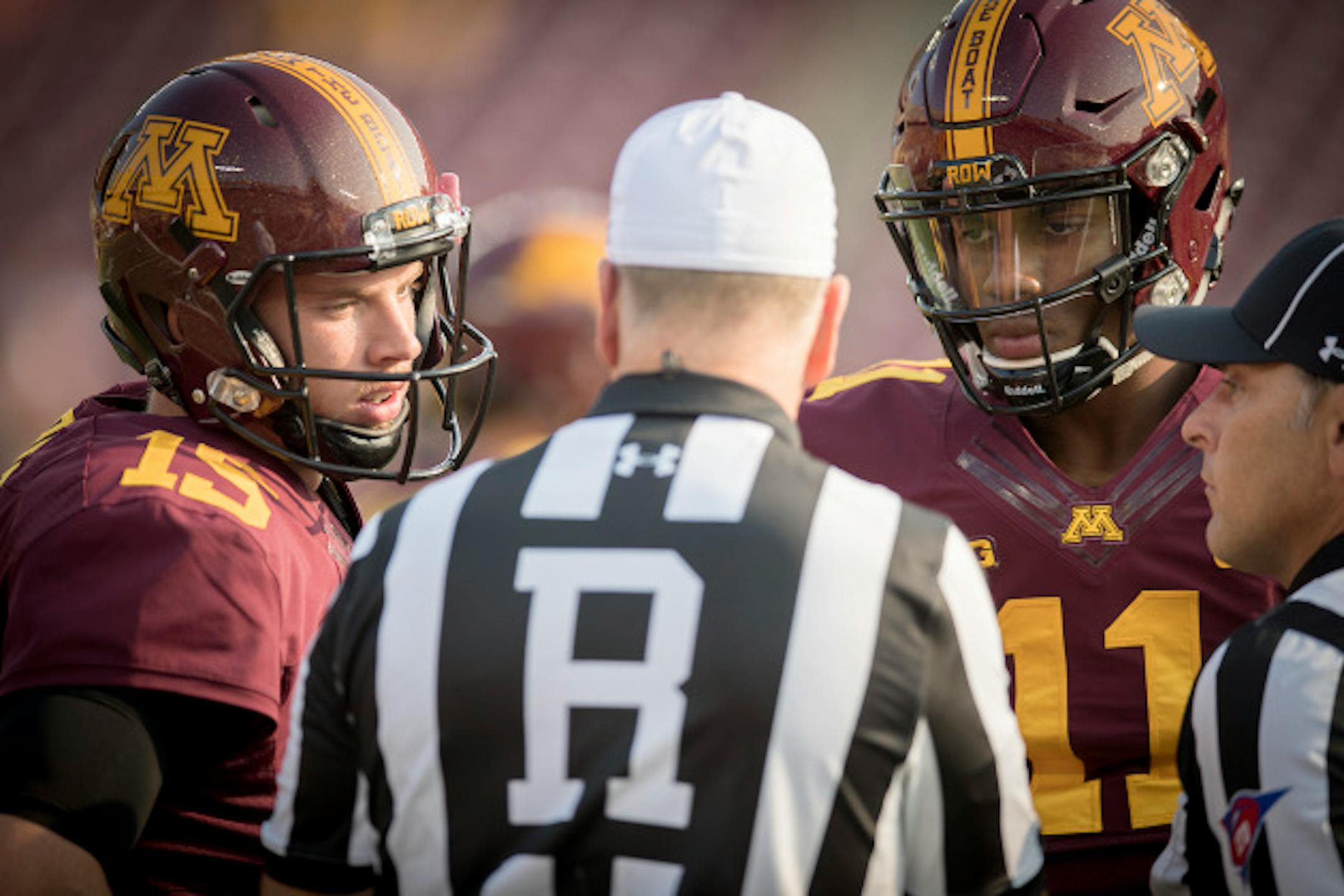 Minnesota's quarterback Conor Rhoda, left, and quarterback Demry Croft listened to the referees before the Gophers took on the Buffalo Bulls at TCF Bank Stadium, Thursday, August 31, 2017 in Minneapolis, MN.    ]  ELIZABETH FLORES ' liz.flores@startribune.com