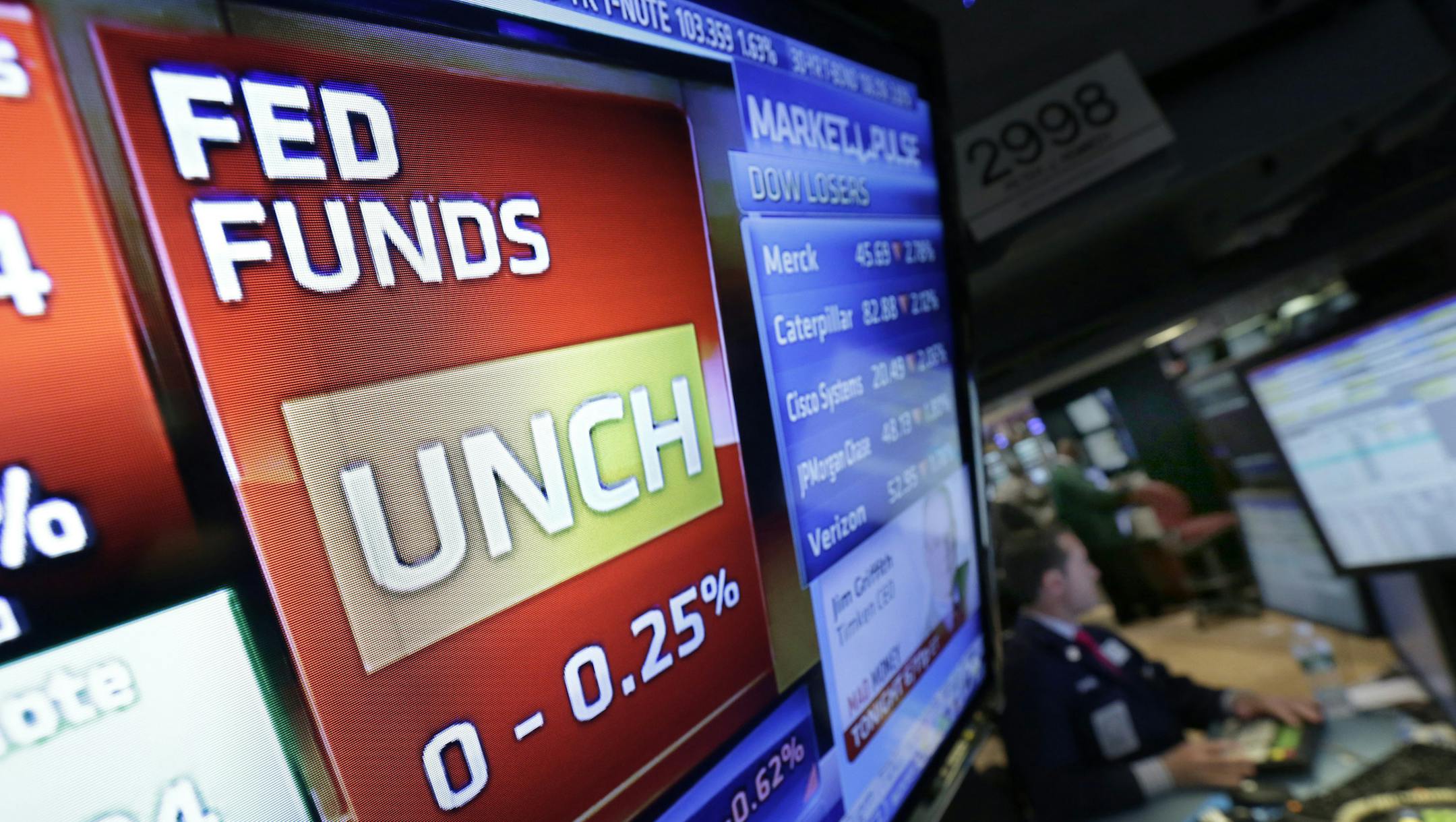 A video screen on the floor of the New York Stock Exchange shows the interest rate decision of the Federal Reserve, Wednesday, May 1, 2013. The Fed maintained its plan to keep short-term interest rates at record lows at least until unemployment falls to 6.5 percent from its current 7.6 percent. (AP Photo/Richard Drew)