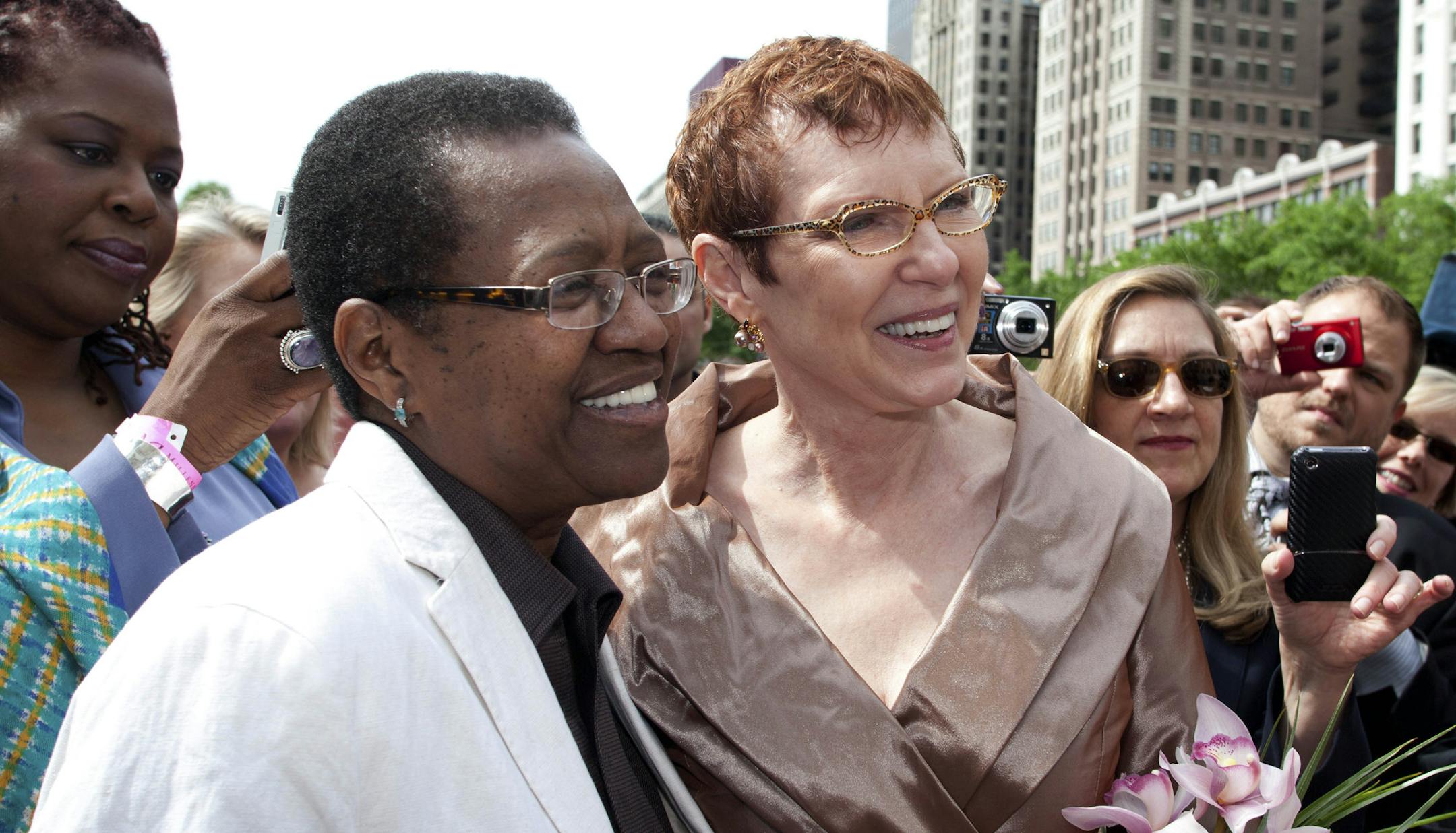 FOR STORY BY SOPHIA TAREEN TO RUN WEDNESDAY PMS, NOV. 27 - This June 2011photo provided by Starbelly Studios in Chicago shows Vernita Gray, left, and Patricia Ewert smiling during their civil union ceremony at Millennium Park in Chicago. U.S. District Judge Thomas Durkin on Monday, Nov. 25, 2013, ordered the Cook County clerk to issue an expedited marriage license to Gray and Ewert before the state's gay marriage law takes effect in June 2014. Gray is terminally ill. (AP Photo/Courtesy of Starbe