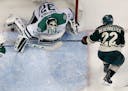 Stars goalie Kari Lehtonen (32) blocked a shot by Nino Niederreiter (22) late in the third period. The play was reviewed by the officials and ruled no
