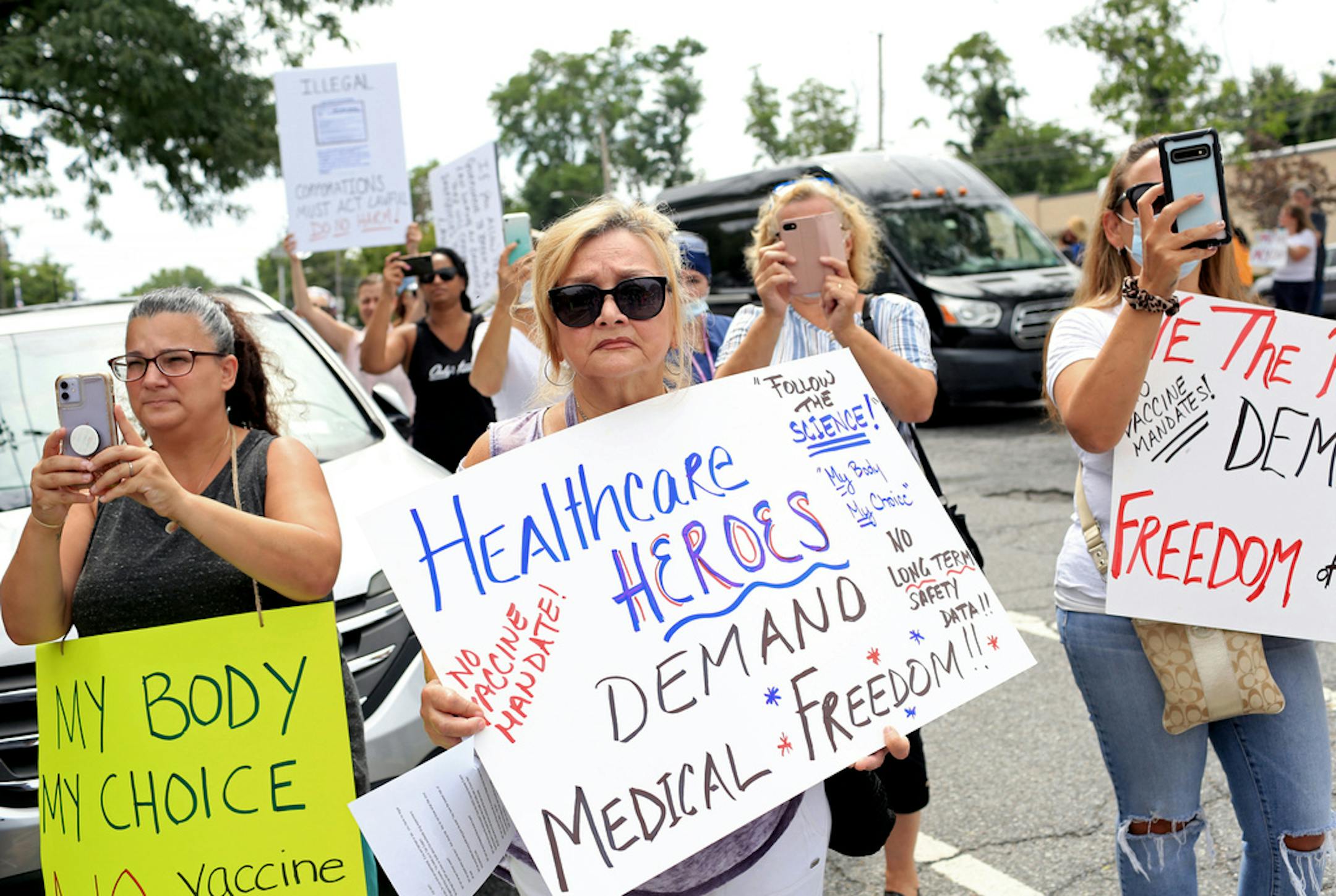 FILE Ñ People protest vaccine mandates for health care workers at Staten Island University Hospital, Northwell Health on Staten Island on Aug. 16, 2021. Barely a day after President Joe Biden issued broad mandates aimed at encouraging American workers to get vaccinated against the coronavirus, the Centers for Disease Control and Prevention released new data highlighting the effectiveness of the shots at preventing infections, hospitalizations and deaths Ñ even while the highly contagious Delta variant has been dominant. (Yana Paskova/The New York Times)