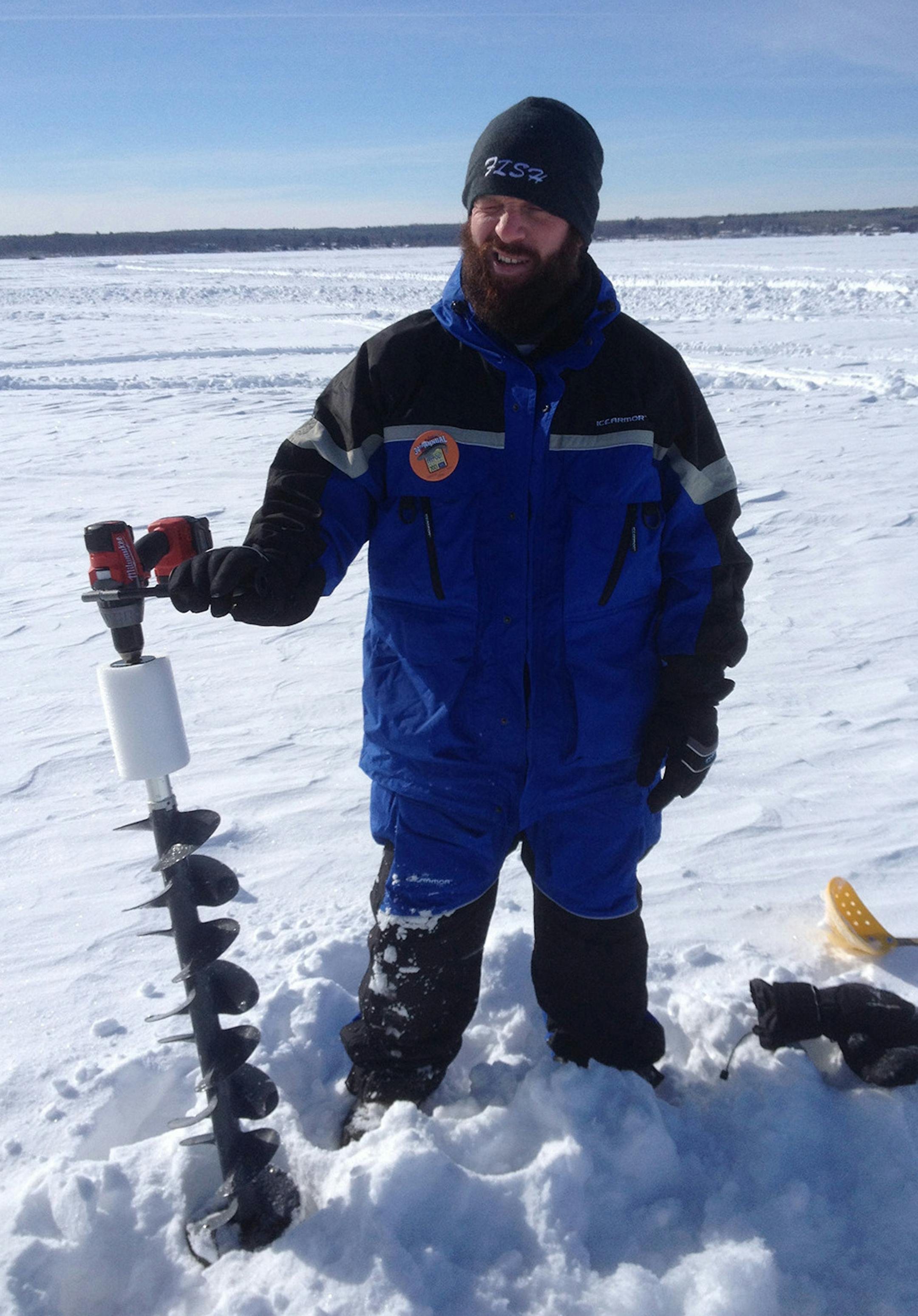 Credit: Donna Dempsey Eric holds an ice drill on the lake. ORG XMIT: Producer Deliverable