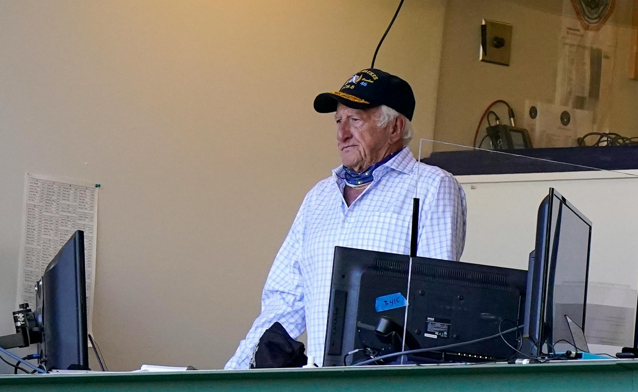 FILE - Milwaukee Brewers broadcaster Bob Uecker stands during the seventh inning of the team's baseball game against the Pittsburgh Pirates on Aug. 30, 2020, in Milwaukee.