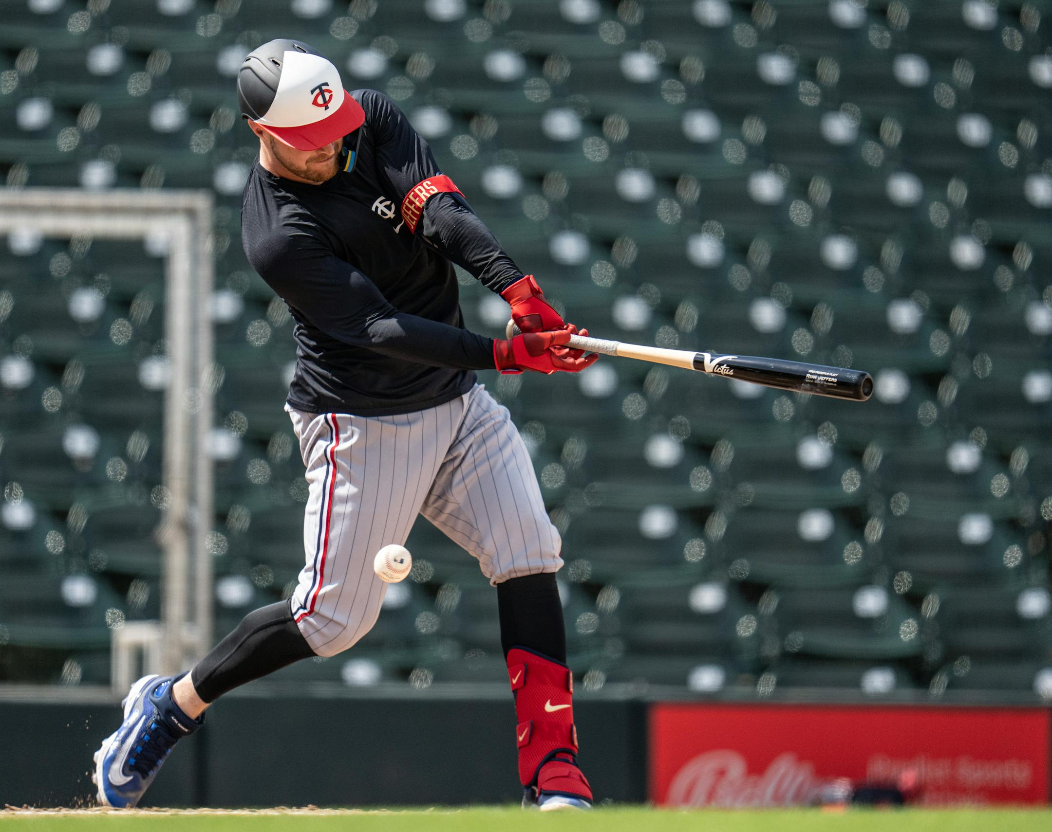 Minnesota Twins catcher Ryan Jeffers takes a strike during live batting practice.