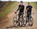 Sean Mailen, left, and Ben Witt of Salsa Cycles pose for a portrait while riding gravel roads in a rural area in Colgate, Minn. on Friday, April 17, 2