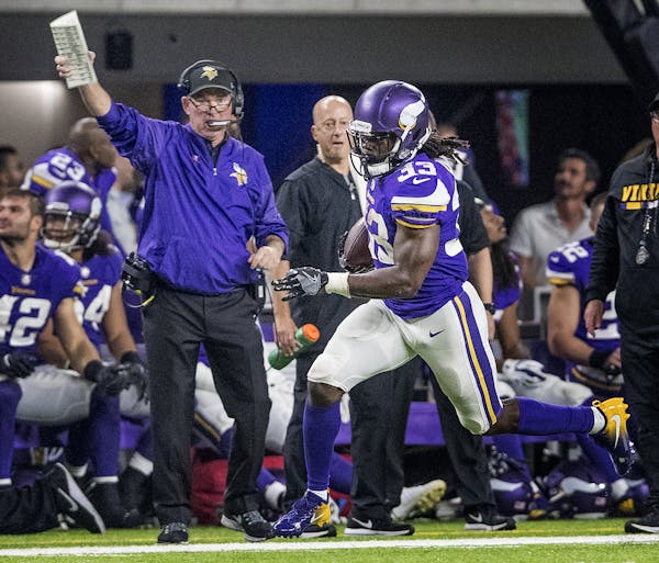Vikings head coach Mike Zimmer watched running back Dalvin Cook on a run in the fourth quarter. Cook set a Vikings record for most rushing yards by a 