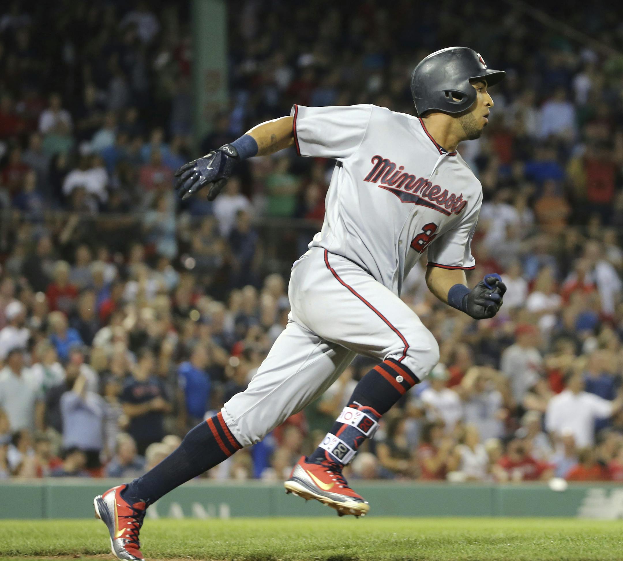 Minnesota Twins' Eddie Rosario runs after hitting a two-run double during the ninth inning of the team's baseball game against the Boston Red Sox at Fenway Park, Friday, July 27, 2018, in Boston. (AP Photo/Elise Amendola)