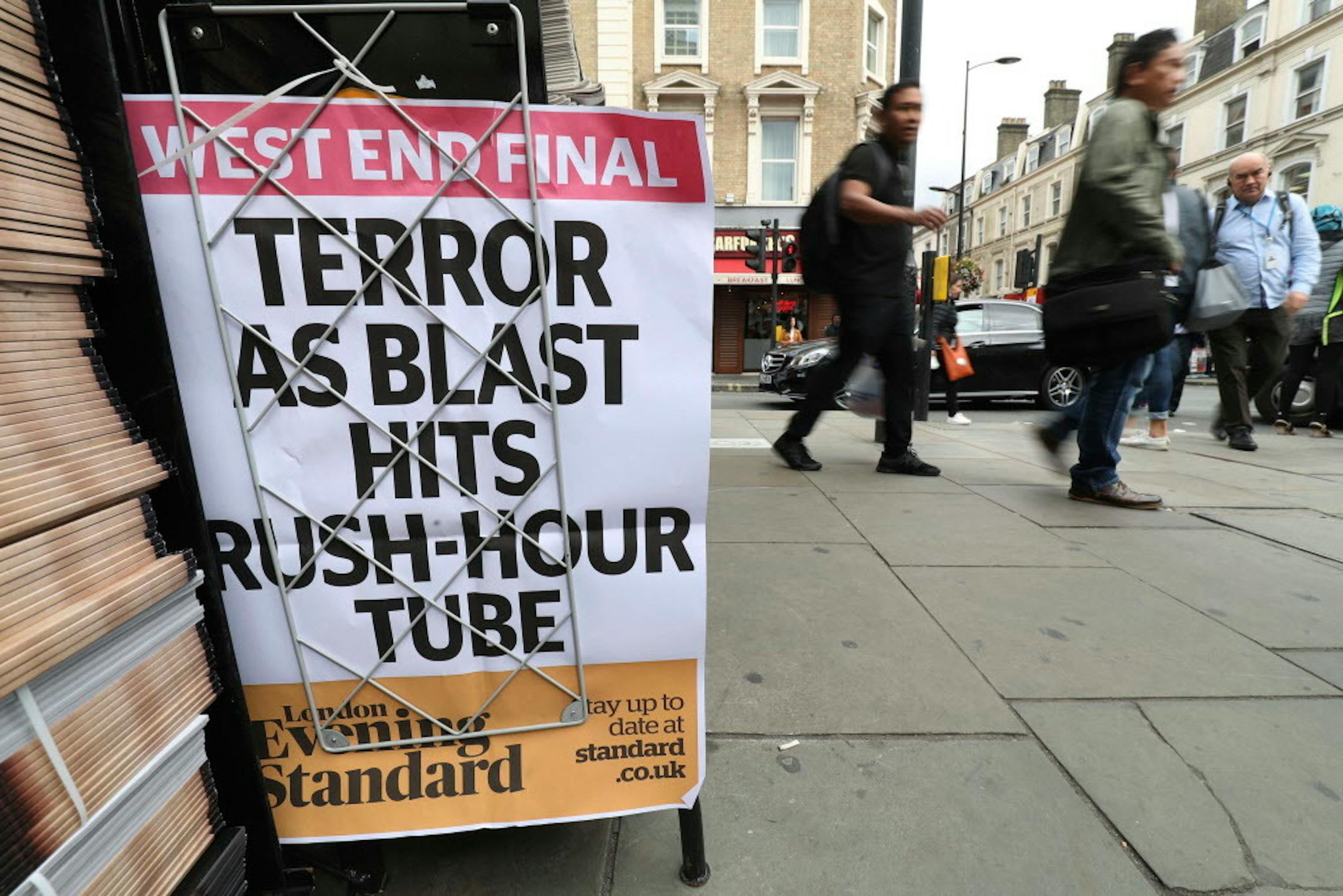 A London evening newspaper stand displays headline outside Paddington tube station in London, after a terrorist incident was declared at Parsons Green subway station Friday, Sept. 15, 2017. A bucket wrapped in an insulated bag caught fire on a packed London subway train early Friday, sending commuters running for safety at the height of the morning rush hour.