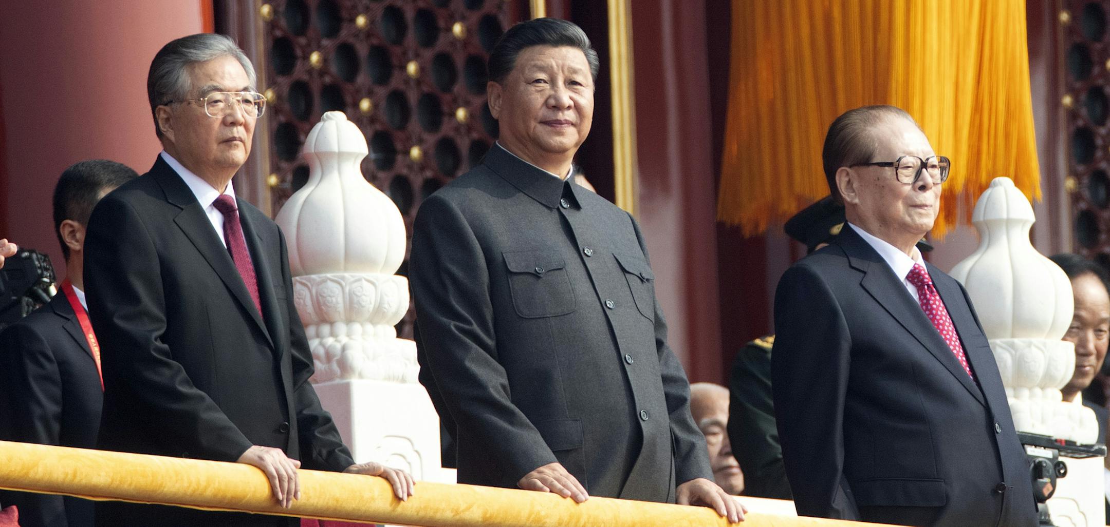 Chinese President Xi Jinping, center, with former presidents Jiang Zemin, right, and Hu Jintao, left, attend the celebration to commemorate the 70th anniversary of the founding of Communist China in Beijing, Tuesday, Oct. 1, 2019. (AP Photo/Ng Han Guan)