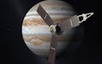 This artist's rendering shows NASA's Juno spacecraft in front of Jupiter.