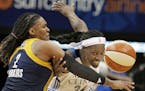 Indiana Fever&#xcc;s Erlana Larkins, left, tries to keep Minnesota Lynx&#xcc;s Sylvia Fowles away from the ball in the second half in Game 1 of the WN