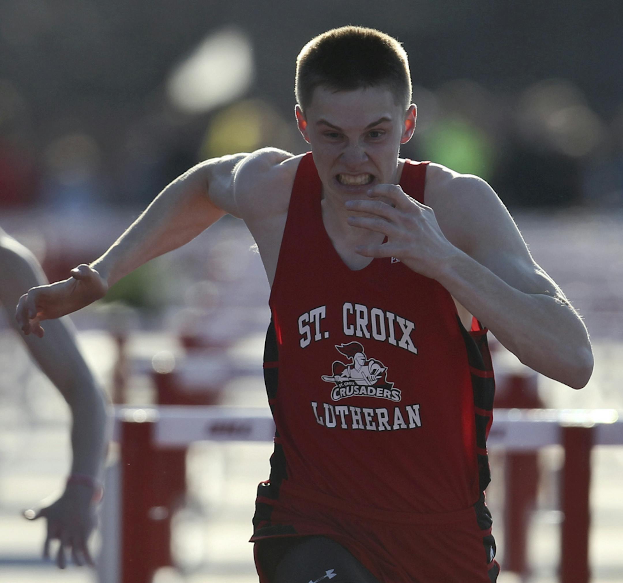 Jon Tollefson of St. Croix Lutheran smoked the competition in the boys 110 meter hurdles with a meet record of 14.42 during the Hamline Elite track meet Friday, April 25, 2014, at Hamline University in St. Paul, MN](DAVID JOLES/STARTRIBUNE) djoles@startribune.com Hamline Elite track meet**Jon Tollefson,cq