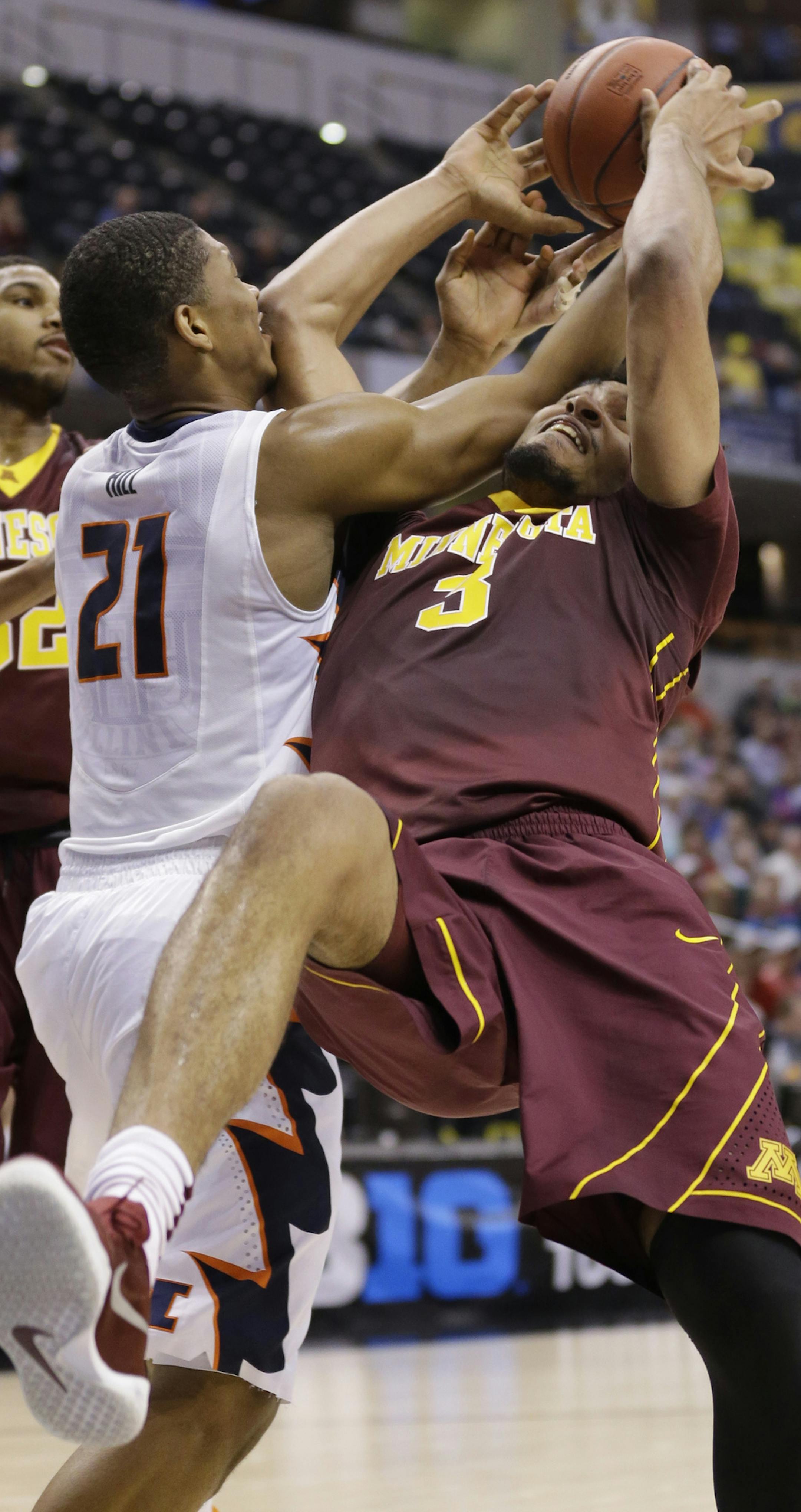 Illinois' Malcolm Hill (21) and Minnesota's Jordan Murphy (3) battle for a rebound in the first half of an NCAA college basketball game of the Big Ten Conference tournament, Wednesday, March 9, 2016, in Indianapolis. (AP Photo/Michael Conroy)