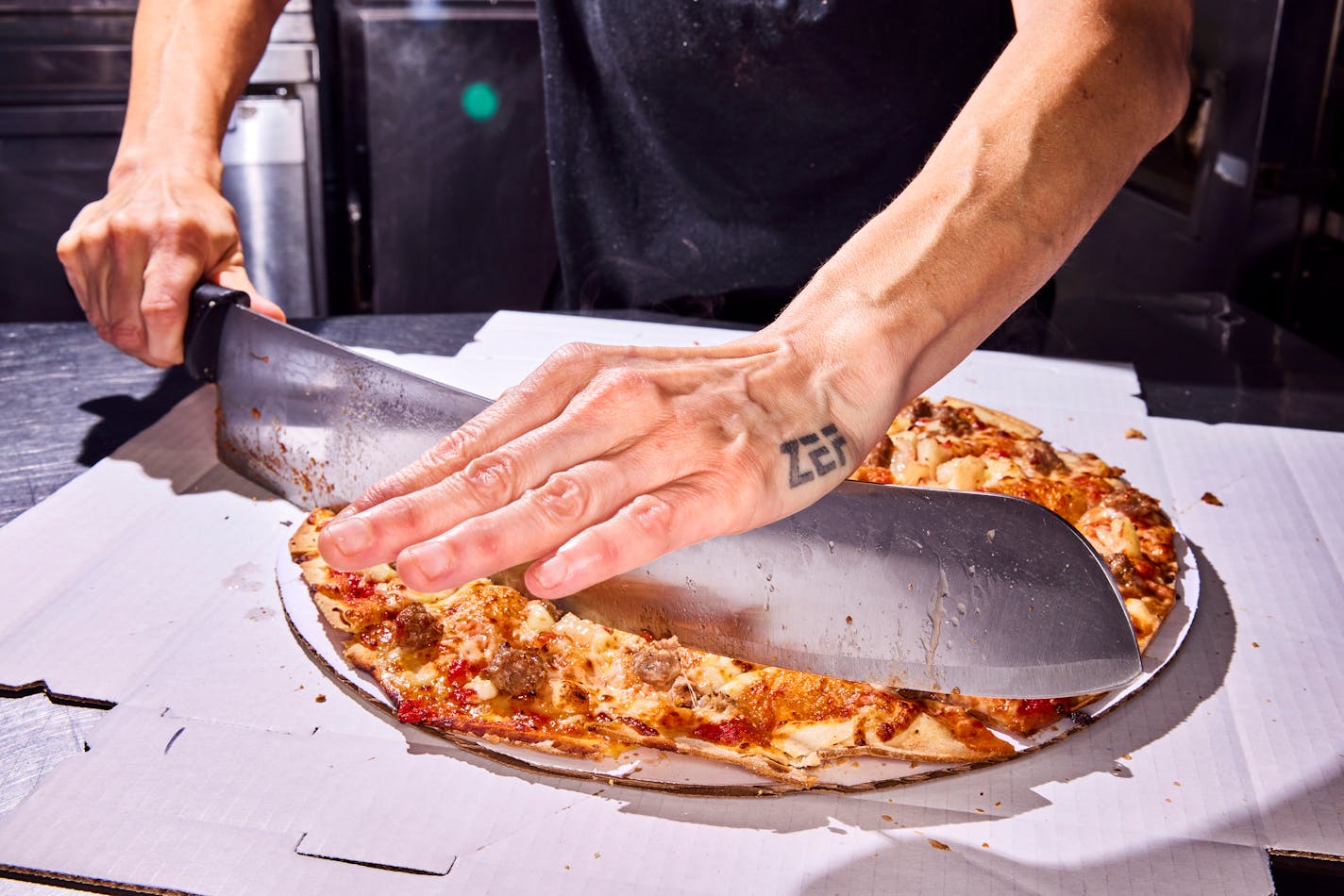 A sausage thin-crust pizza at My Pi Pizza in Chicago. MUST CREDIT: Photo for The Washington Post by Jason Little