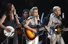 The Dixie Chicks, from left, Emily Robison, Natalie Maines and Martie Maguire perform the song "Landslide" at the 45th Annual Grammy Awards, Sunday, F