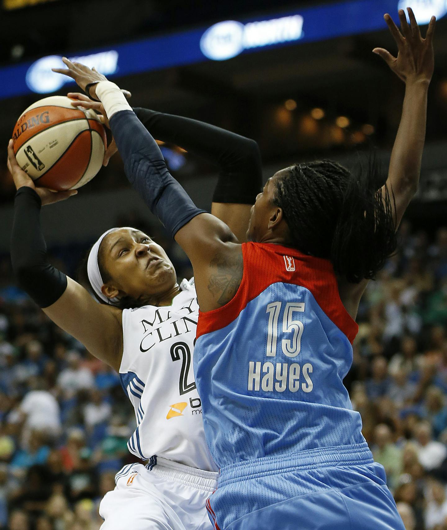 Minnesota Lynx forward Maya Moore (23) is fouled as she shoots the ball by Atlanta Dream guard Tiffany Hayes (15) during the first half of a WNBA basketball game, Friday, July 31, 2015, in Minneapolis. (AP Photo/Stacy Bengs)