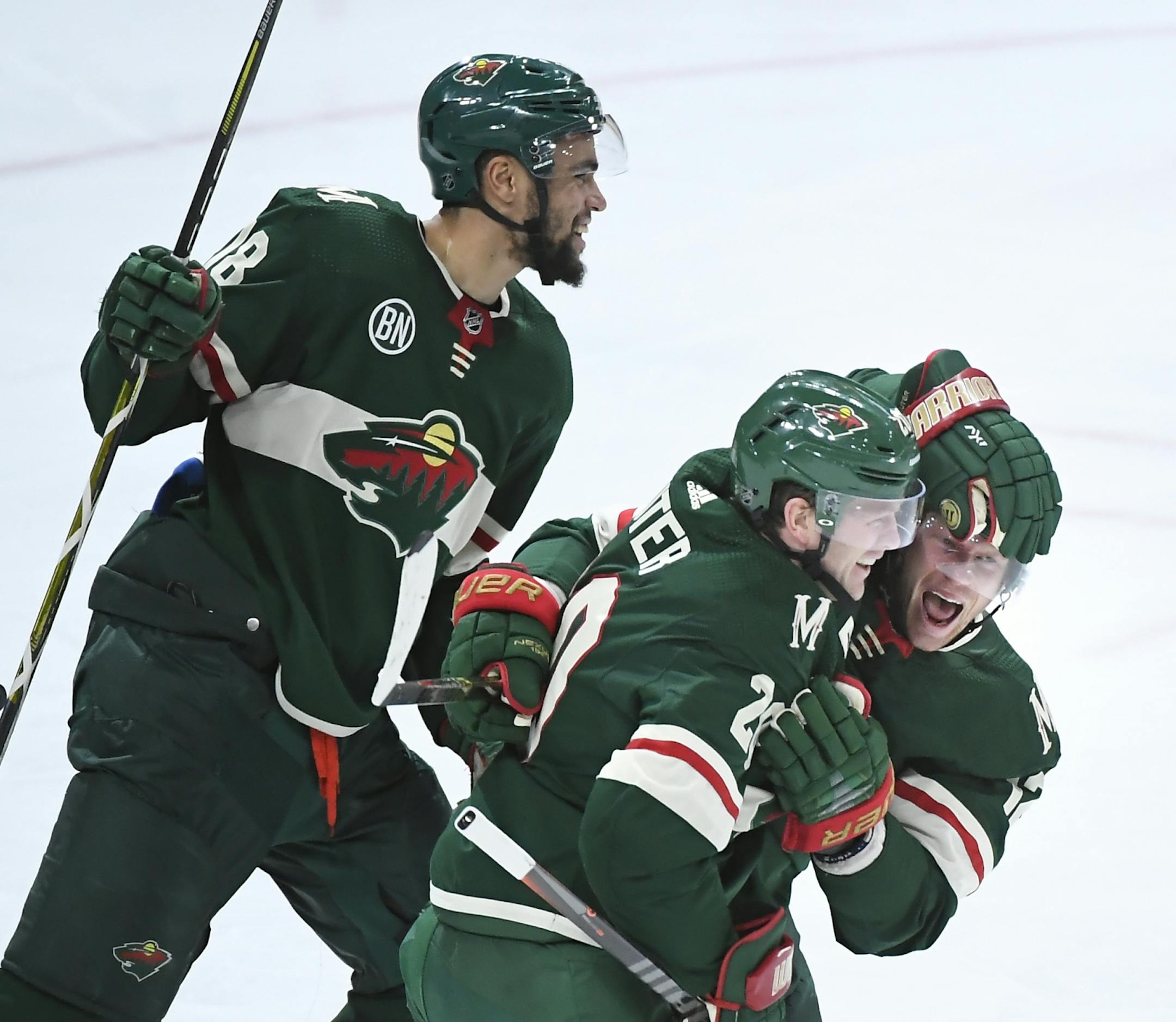 From left, Minnesota Wild left wing Jordan Greenway (18), defenseman Ryan Suter (20) and center Eric Staal (12) celebrated a goal by Staal in the third period Tuesday against the Los Angeles Kings.