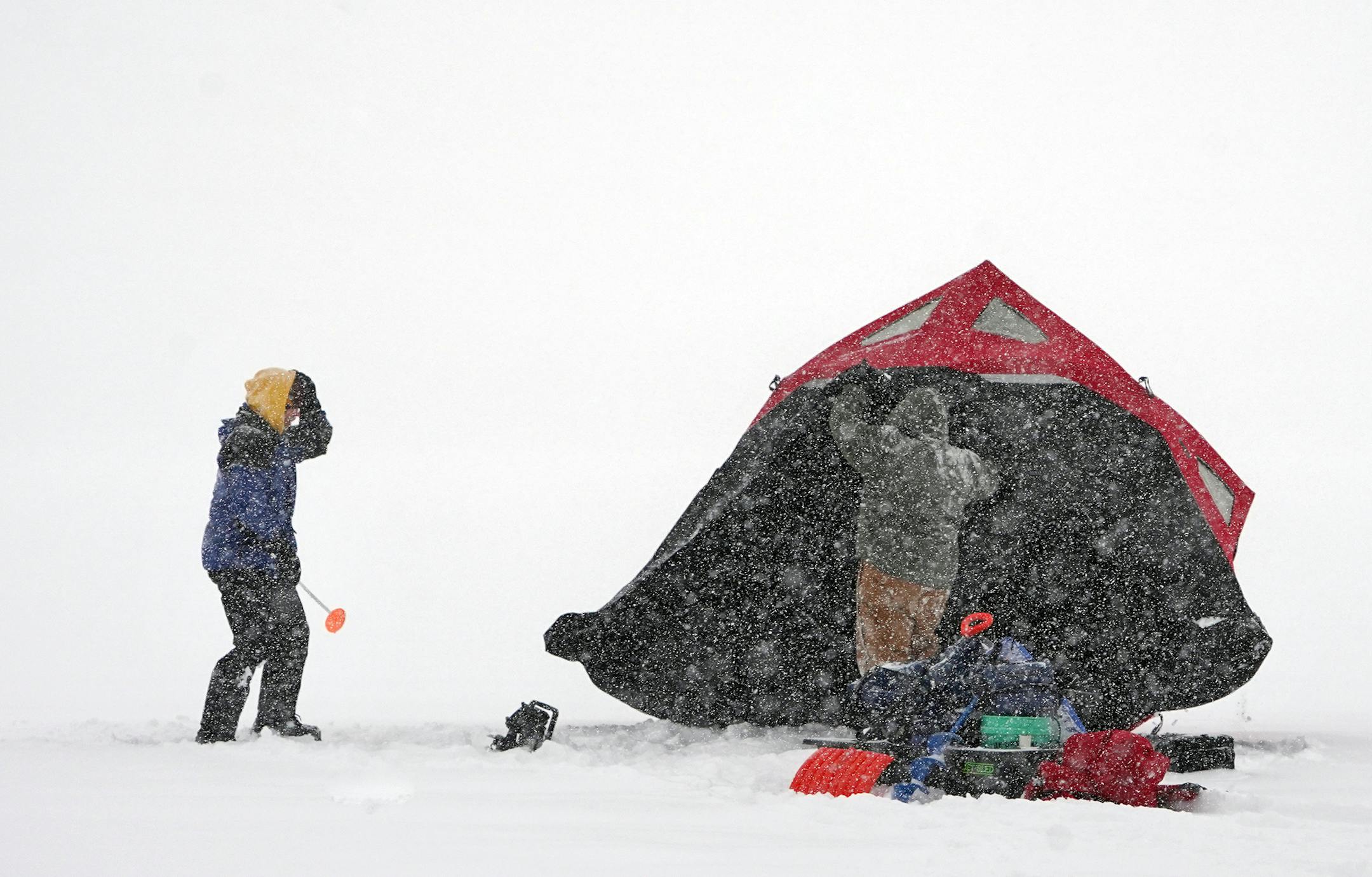 L to R: Daryl Larson and Matt Berkowitz found the conditions ideal for ice fishing. The fact that they were not working made them ideal. They were going for some perch and walleye.] Weather features around the metro. RICHARD TSONG-TAATARII ¥ richard.tsong-taatarii@startribune.com