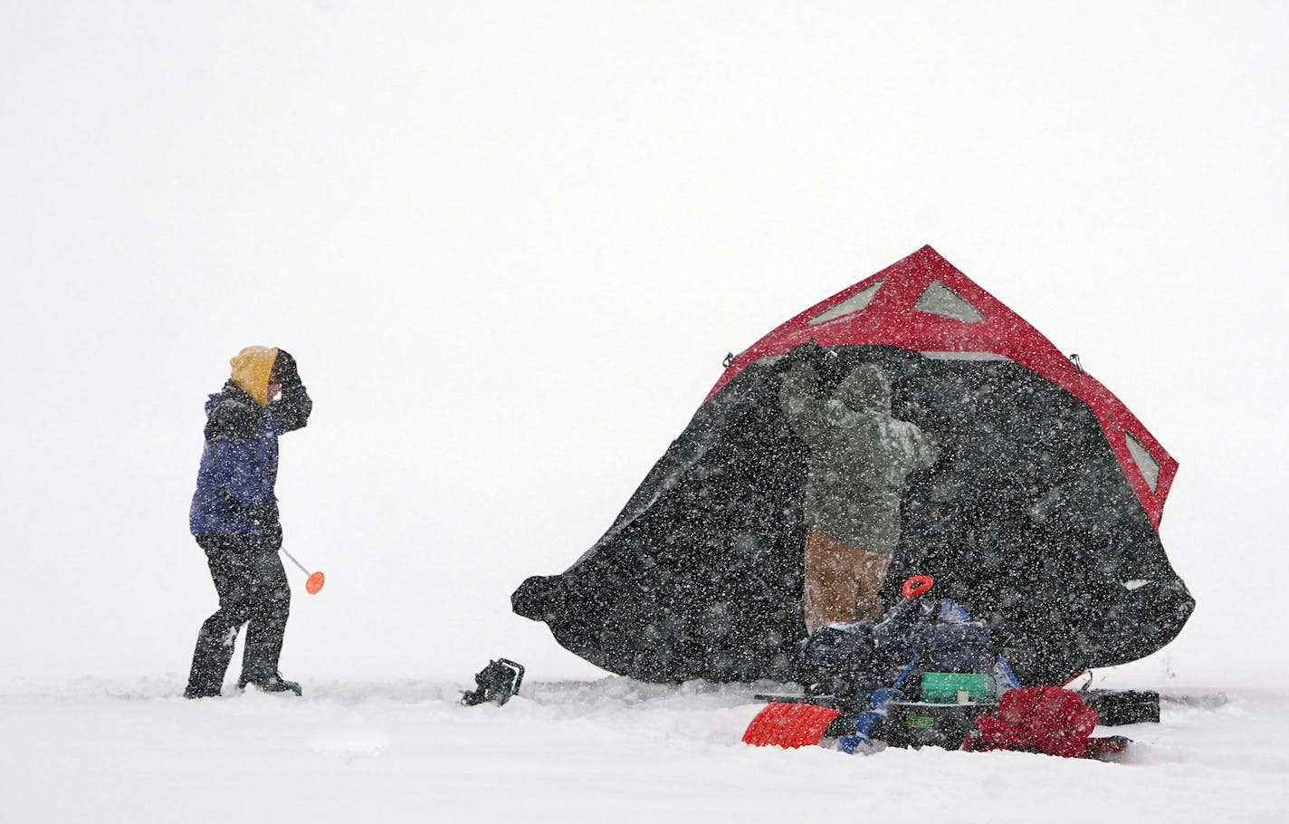 L to R: Daryl Larson and Matt Berkowitz found the conditions ideal for ice fishing. The fact that they were not working made them ideal. They were going for some perch and walleye.] Weather features around the metro. RICHARD TSONG-TAATARII &#xa5; richard.tsong-taatarii@startribune.com