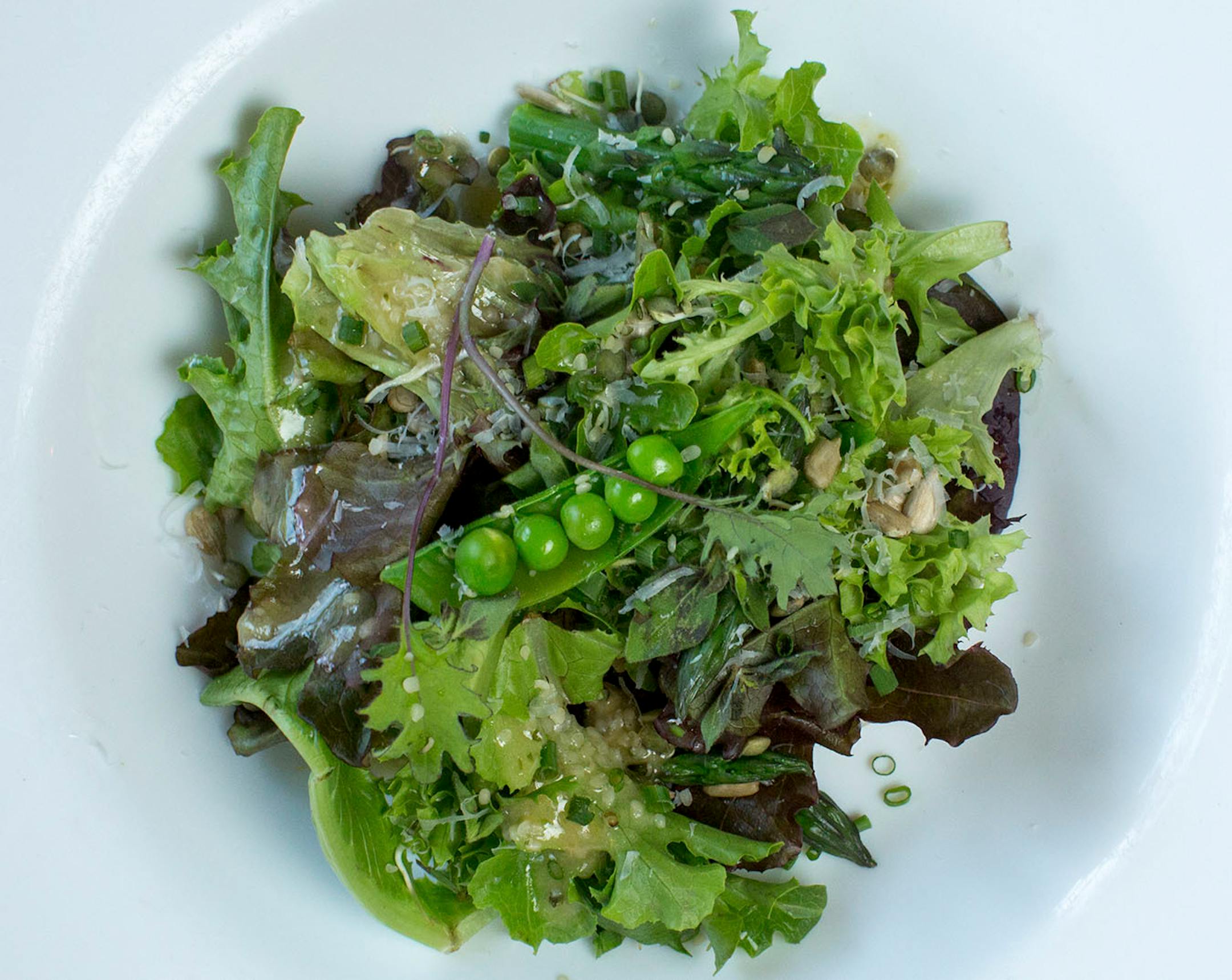 Chef Shack serves Bay City greens with sesame seeds, spring asparagus, sunflower seeds and sprouted lentils. ] COURTNEY PEDROZA • courtney.pedroza@startribune.com June 22-24, 2017; Wisconsin restaurants, cafes, bars, bakeries and breweries; Dining along the Mississippi River.