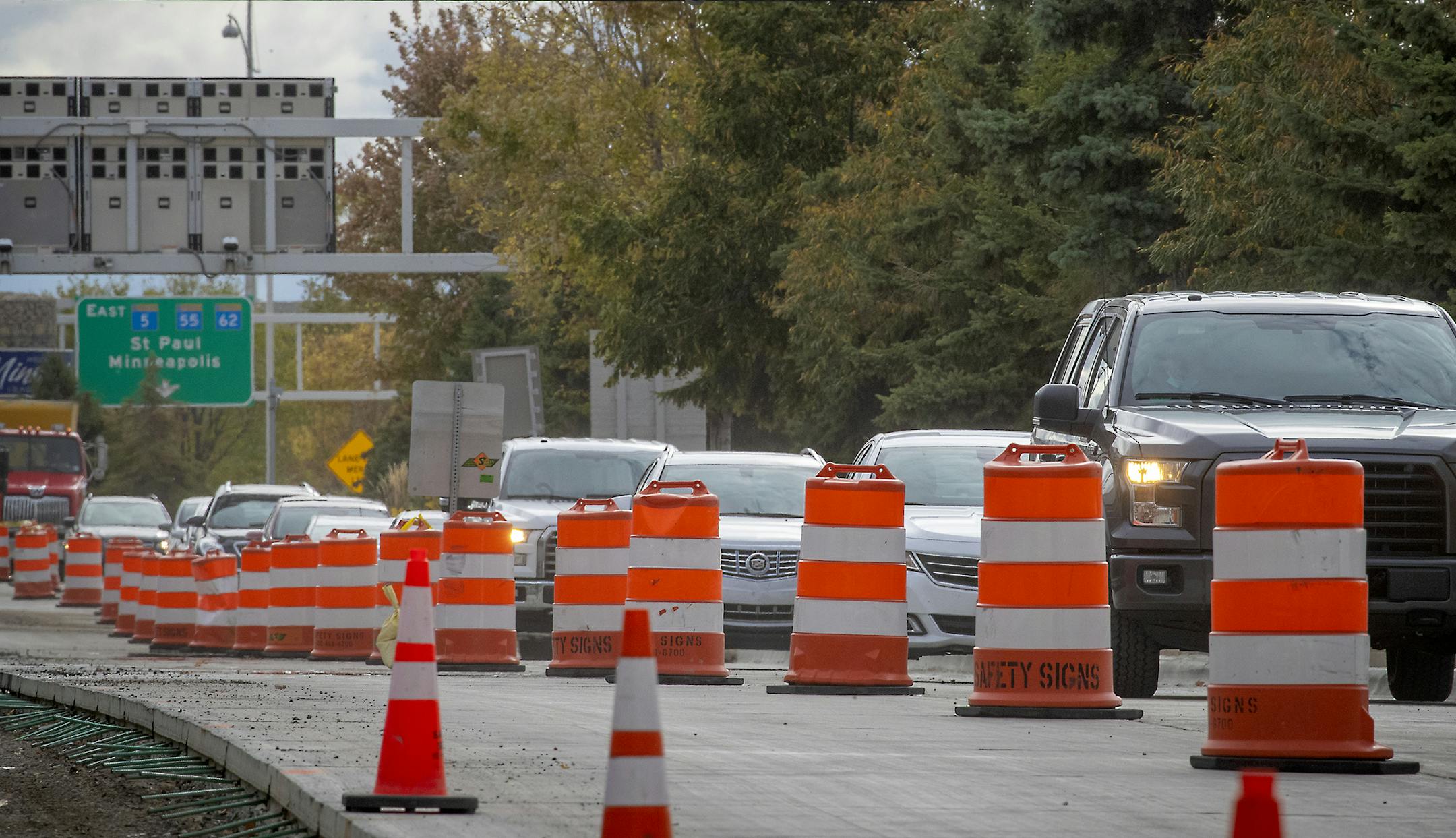 Workers worked along Glumack Drive, likely one of the busiest thoroughfares in the state, Monday, September 28, 2020 in Bloomington, MN. The quarter-mile roadway feeds into the Minneapolis-St. Paul International Airport and was in dire need of repair. Now, through an odd quirk of fate -- the global pandemic -- the road is being overhauled with minimual disruption because air travel has plunged and workers can proceed with the project largely unimpeded. ] ELIZABETH FLORES • liz.flores@startribune