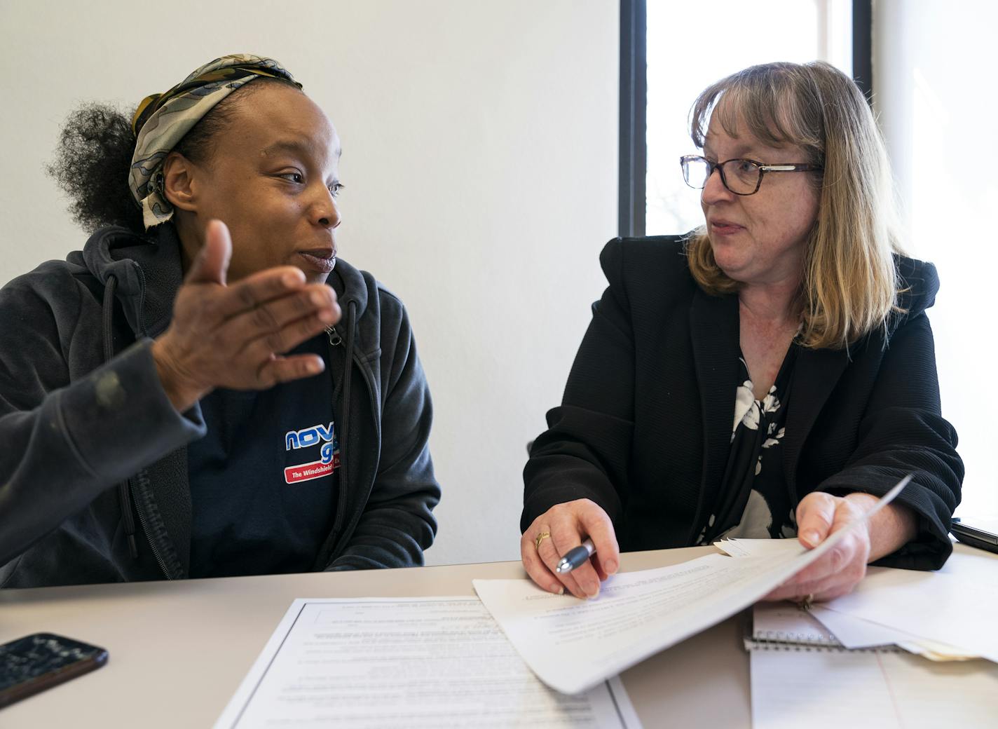 Kamarra Johnson meets with attorney Barbara White, right, an attorney with Target Corp. during an eviction expungement legal clinic. Johnson is trying to get an expungement of an eviction in 2014. ] LEILA NAVIDI &#xa5; leila.navidi@startribune.com BACKGROUND INFORMATION: Attorneys meet with clients during a pro bono legal clinic for eviction expungement at North Regional Library in Minneapolis on Tuesday, April 9, 2019.