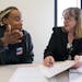 Kamarra Johnson meets with attorney Barbara White, right, an attorney with Target Corp. during an eviction expungement legal clinic. Johnson is trying