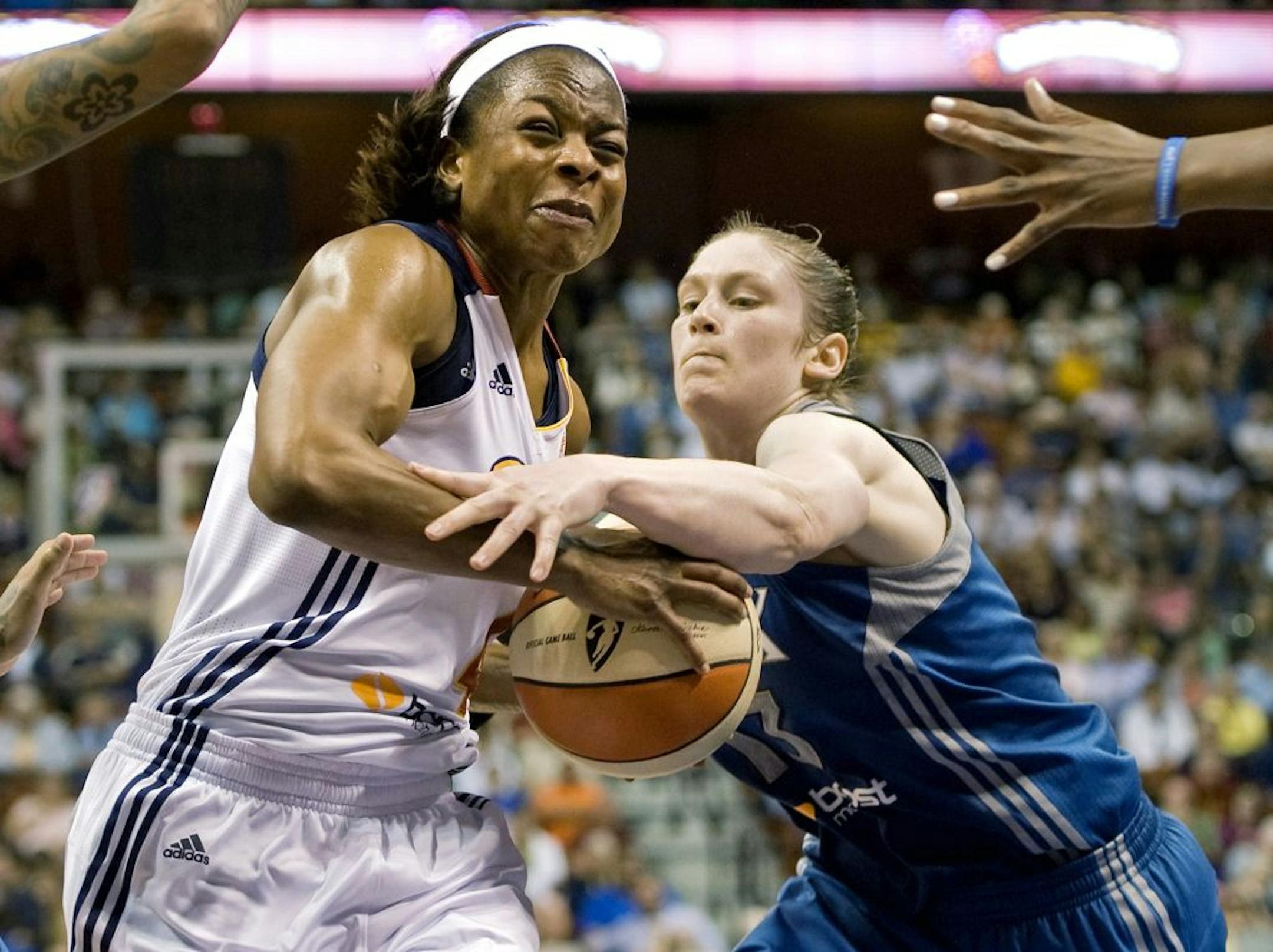 Connecticut Sun's Danielle McCray, left, is pressured by Minnesota Lynx' Lindsay Whalen during the second half of a WNBA basketball game in Uncasville, Conn., Friday, June 1, 2012. The Lynx defeated the Sun 85-72.