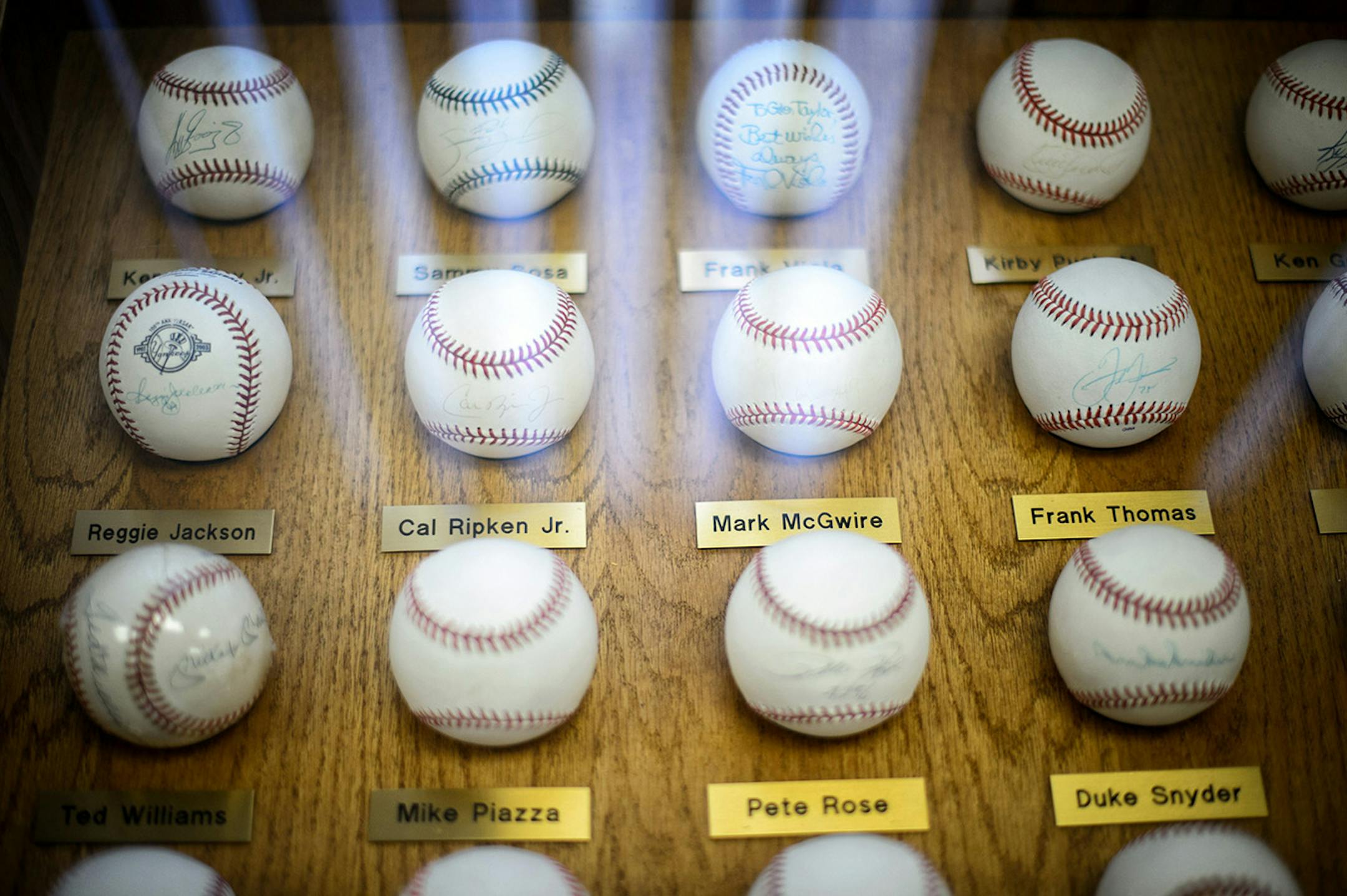 Autographed baseball collection in Glen Taylor's North Mankato office.