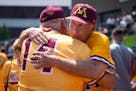 Gophers coach John Anderson hugs his brother Mike at his retirement ceremony last weekend at Siebert Field.