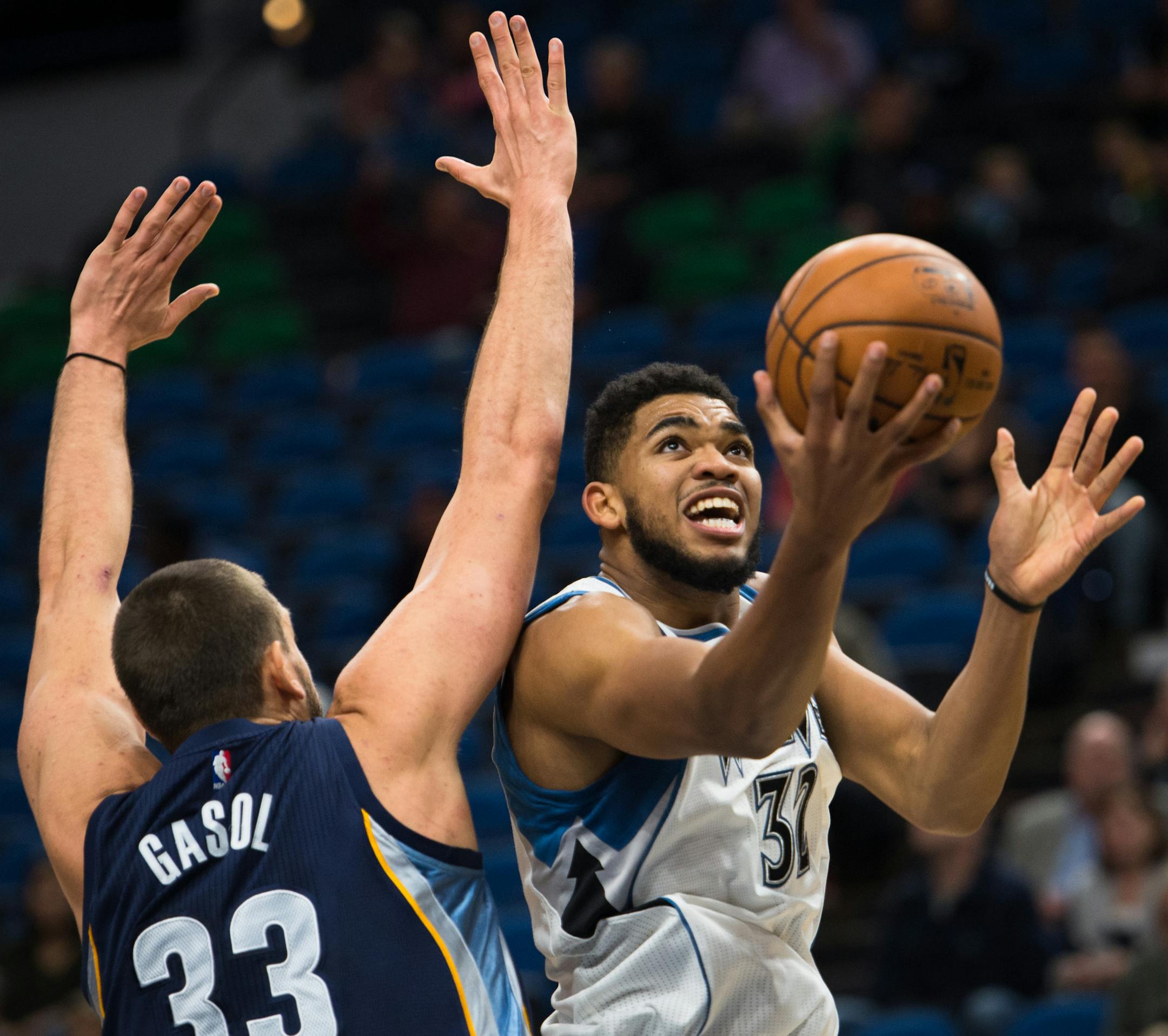 Minnesota Timberwolves forward Karl-Anthony Towns (32) scored a layup under the defense of Memphis Grizzlies center Marc Gasol (33) in the first quarter Wednesday night. ] (AARON LAVINSKY/STAR TRIBUNE) aaron.lavinsky@startribune.com The Minnesota Timberwolves played the Memphis Grizzlies in a preseason game on Wednesday, Oct. 19, 2016 at Target Center in Minneapolis, Minn.