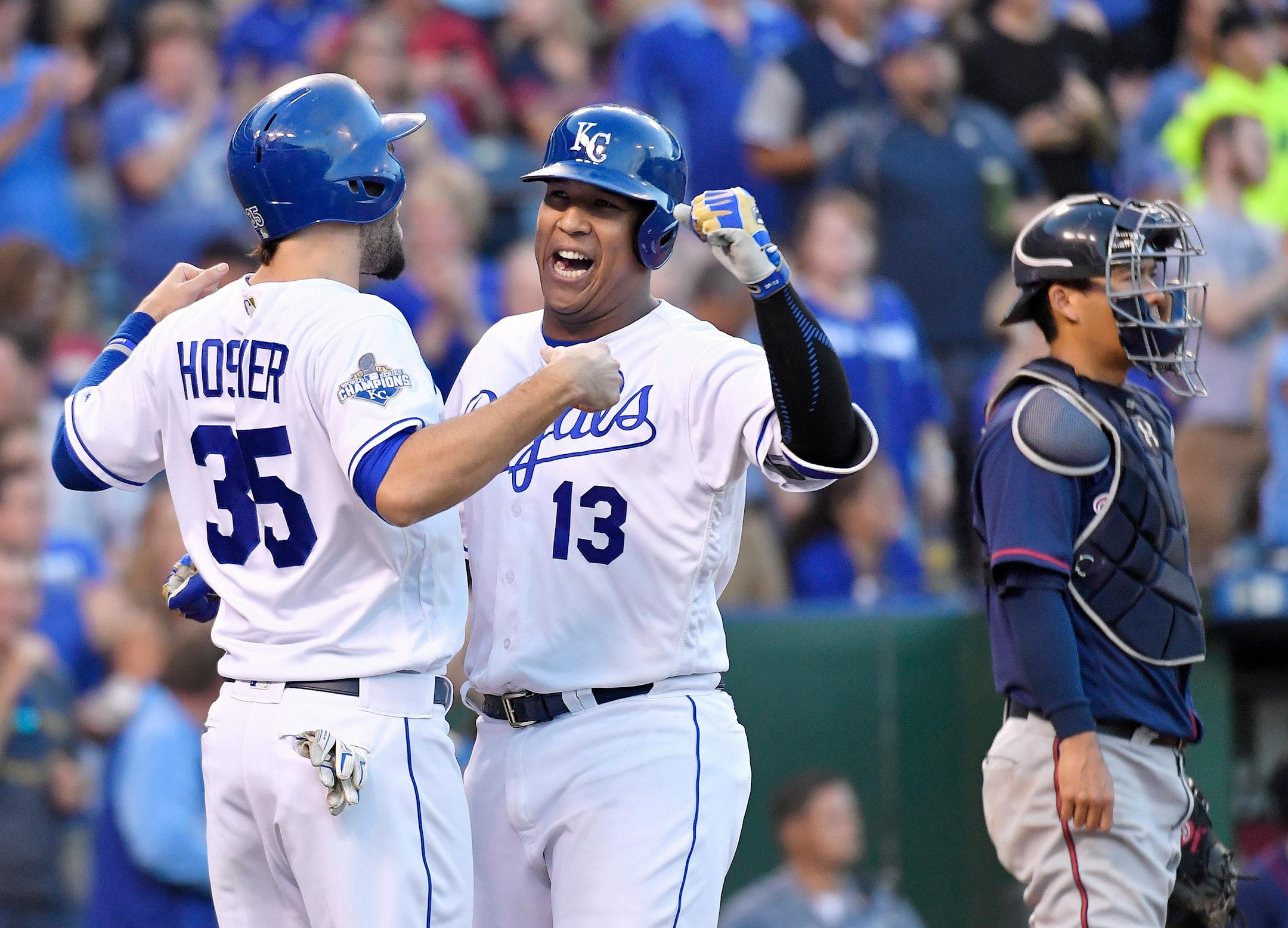 Kansas City Royals' Salvador Perez is greeted by Eric Hosmer behind Kansas City Royals third baseman Mike Moustakas after hitting a two run home run in the fifth inning during Saturday's baseball game on Aug. 20, 2016 at Kauffman Stadium in Kansas City, Mo. (John Sleezer/Kansas City Star/TNS)