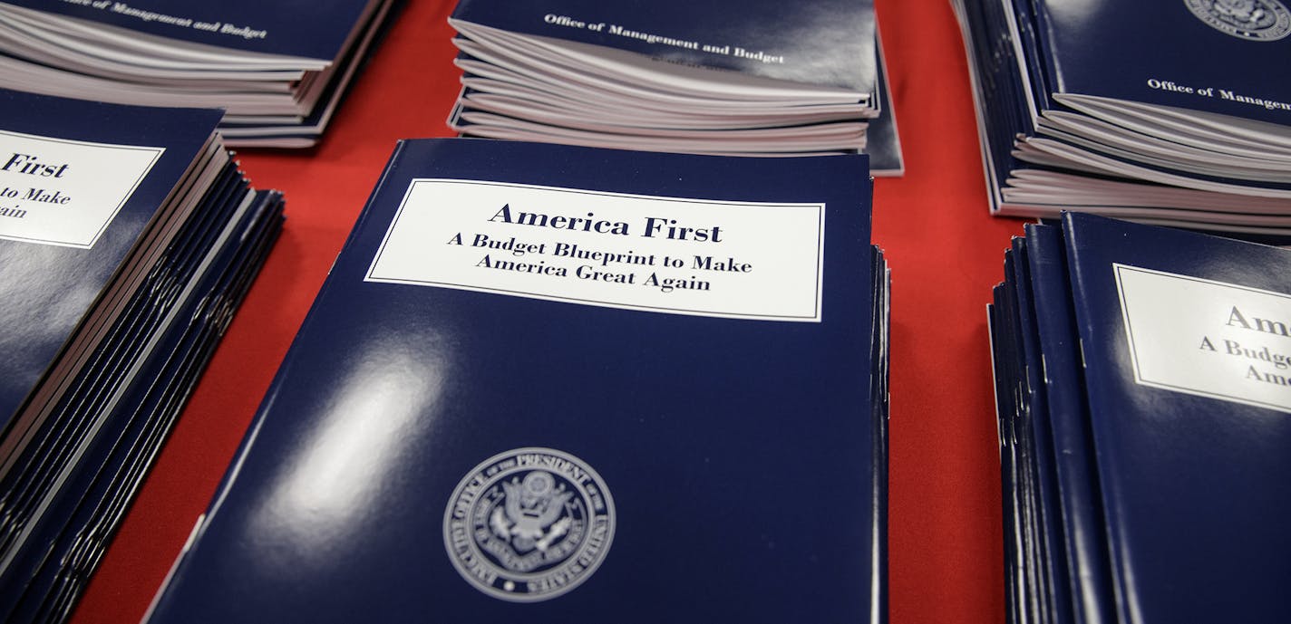 Copies of President Donald Trump's first budget are displayed at the Government Printing Office in Washington, Thursday, March, 16, 2017. Trump unveiled a $1.15 trillion budget on Thursday, a far-reaching overhaul of federal government spending that slashes many domestic programs to finance a significant increase in the military and make a down payment on a U.S.-Mexico border wall. (AP Photo/J. Scott Applewhite) ORG XMIT: MIN2017031607311003