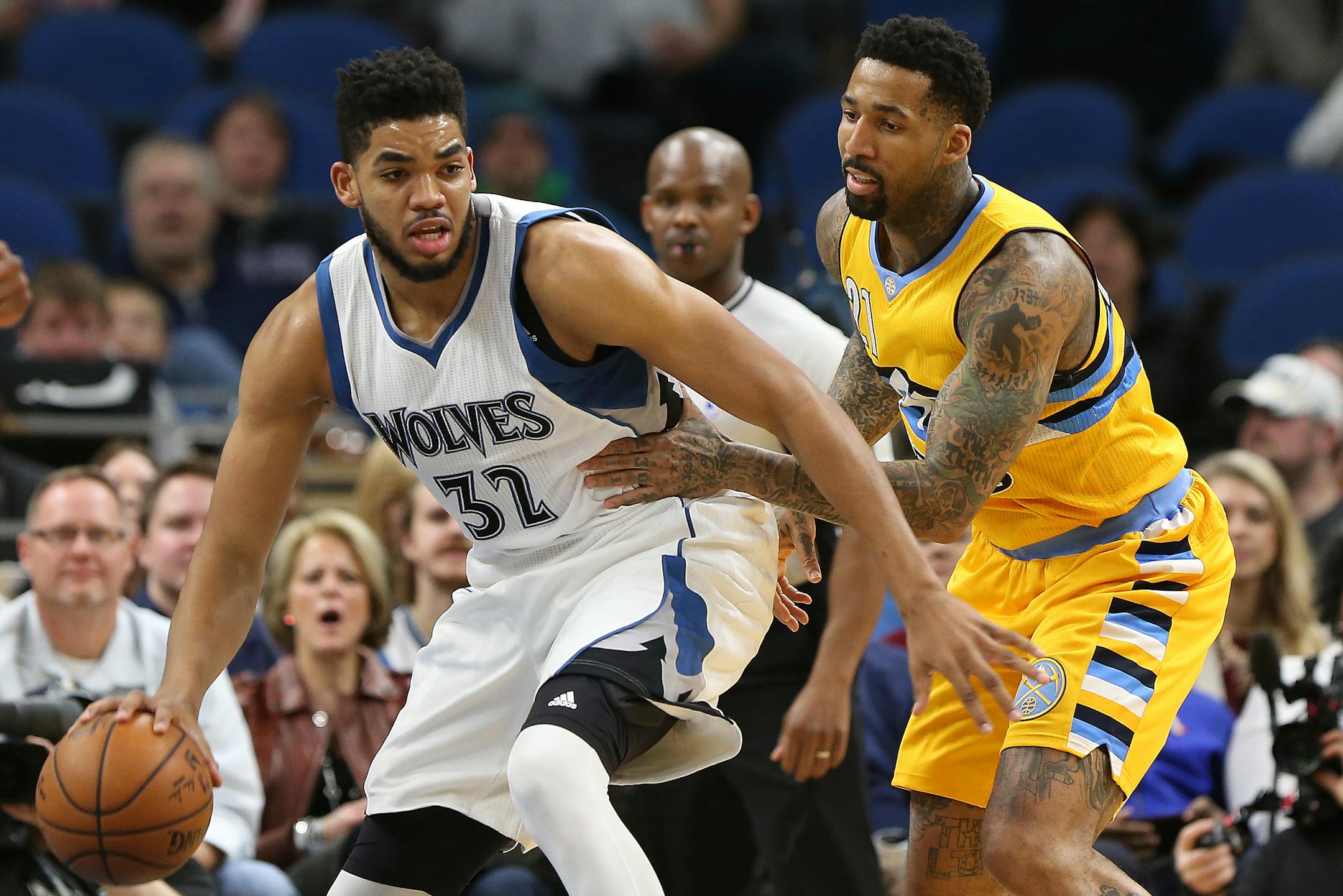 Timberwolves center Karl-Anthony Towns worked against Nuggets forward Wilson Chandler in the first half Sunday.