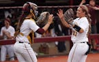 Gophers pitcher Amber Fiser (13) celebrated with catcher Emma Burns (5) after getting the third out. ] ANTHONY SOUFFLE &#x2022; anthony.souffle@startr