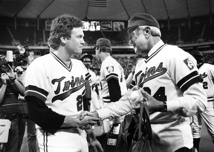 New team owner Carl Pohlad, right, wearing #84, shook hands with Minnesota Twins pitcher Len Whitehouse at the Metrodome, Friday night June 22, 1984.