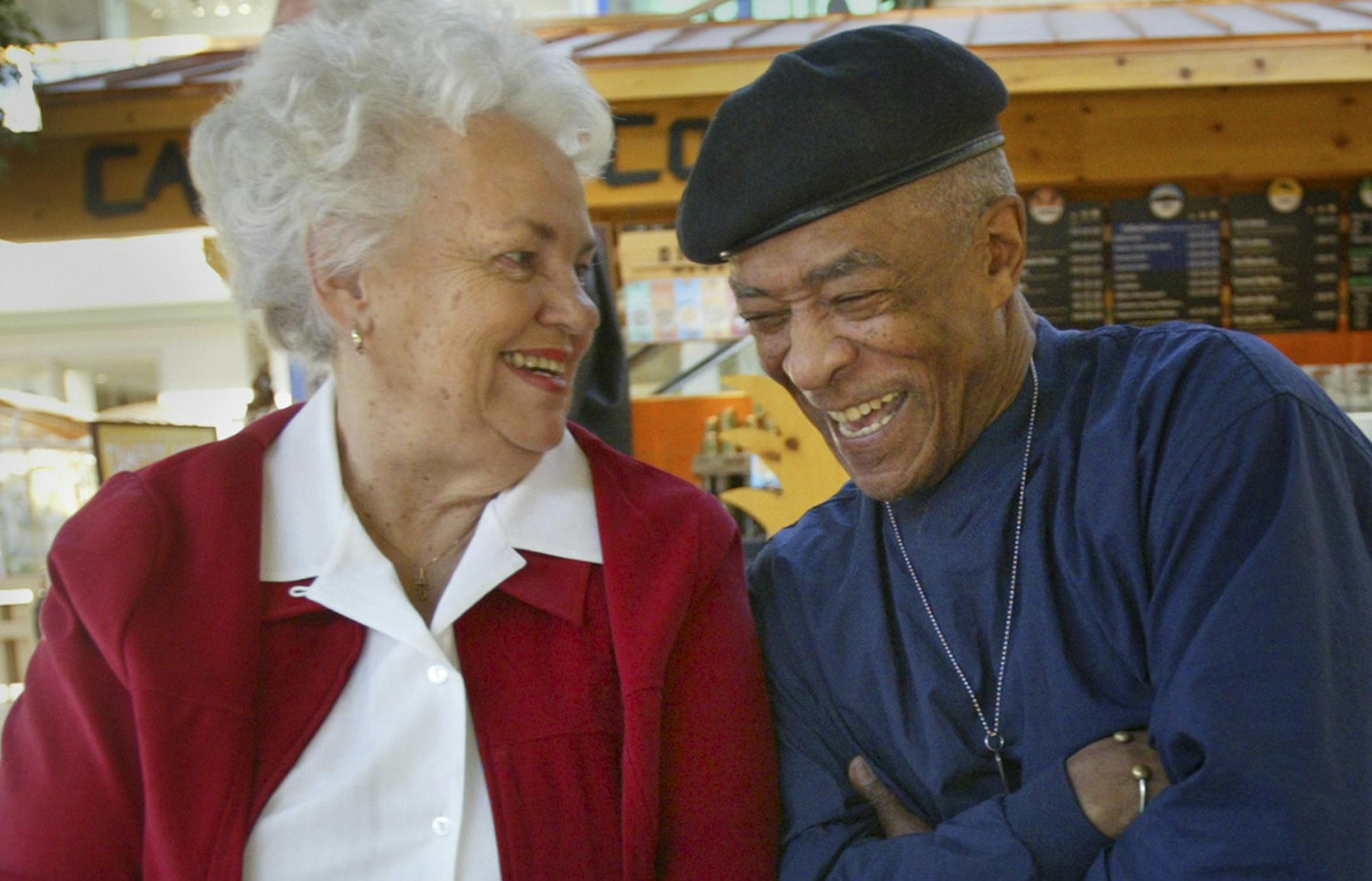Renee Jones/Star Tribune 3/1/05 Minnetonka, Minn. More than 50 years since being crowned homecoming king and queen at Central High School Janet Berry and Bob Blakely chat over a cup of coffee and old newspaper clippings at Ridgedale Mall in Minnetonka. The last time they saw each other was at their 40th reunion. GENERAL INFORMATION: At Central High School in 1954, school integration hadn't taken effect, so when Bob Blakely, the powerful black athlete was voted Homecoming King and Janet Berry, th