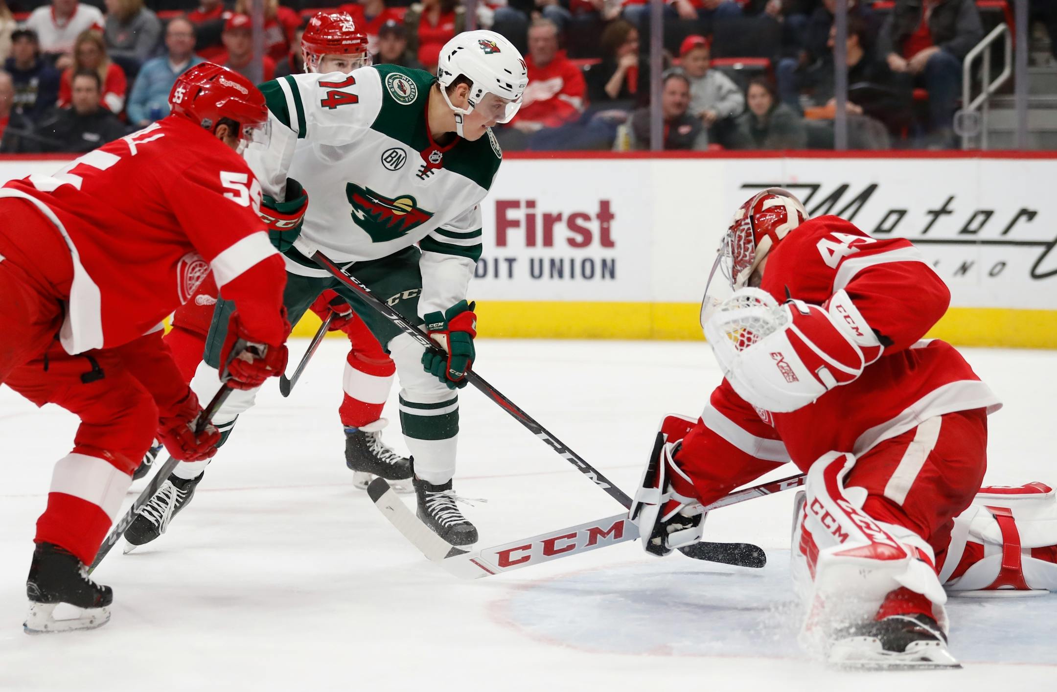 Detroit Red Wings goaltender Jonathan Bernier deflects a shot by Wild center Joel Eriksson Ek during the second period