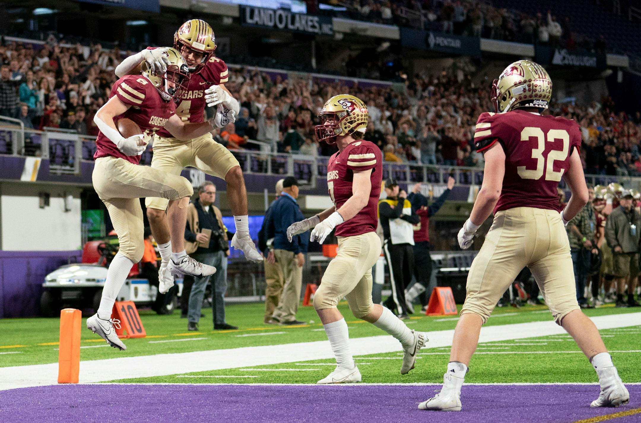 Lakeville South defensive backs celebrate after Hunter Webster recovered a muffed punt against Maple Grove in the second quarter.