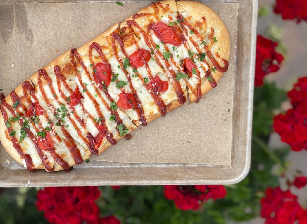 Chicken flatbread with a barbecue drizzle among the stunning vistas outside Scandia.