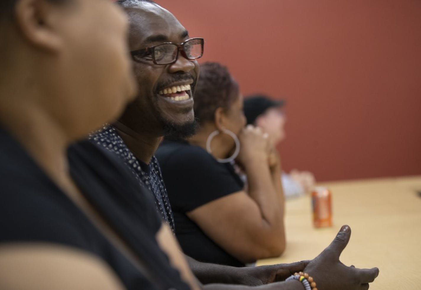 Joseph Lawrence applauded during graduation ceremonies at Avivo on Aug. 1 in Minneapolis. The nonprofit received just shy of $500,000 from the Legislature for the next two years.