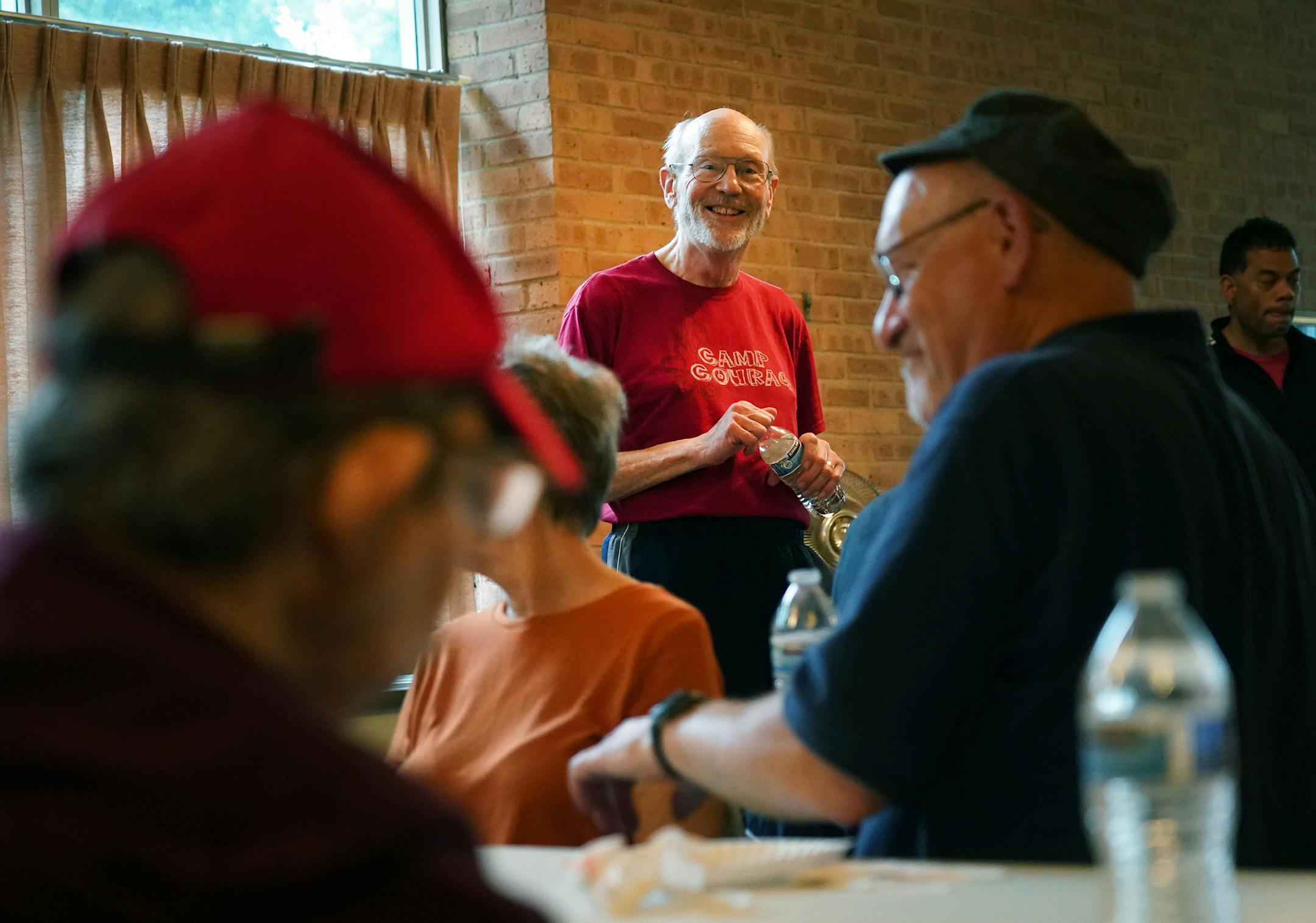 Richard Luedtke (center) led conversation and prayer inside the Spirit of St. Stephens Catholic Church Community. ] Shari L. Gross • shari.gross@startribune.com About once a month, a group of volunteers and developmentally challenged parishioners from Spirit of St. Stephens Catholic Church Community gather together to have an adventure. On Saturday, July 20, 2019, the group boarded the Minneapolis Queen run by Paradise Charter Cruises and toured the Mississippi River. After the rainy crui