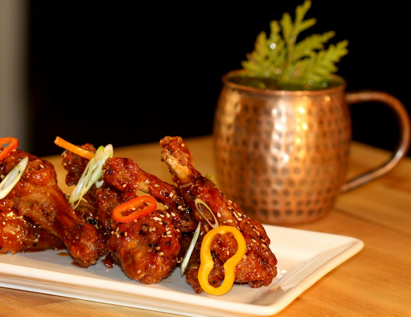 Beard Wrecker Duck Wings with a Specialty Northwoods Mule Cocktail at Poplar Haus, a recently opened restaurant on the Gunflint Trail. Courtesy of Poplar Haus