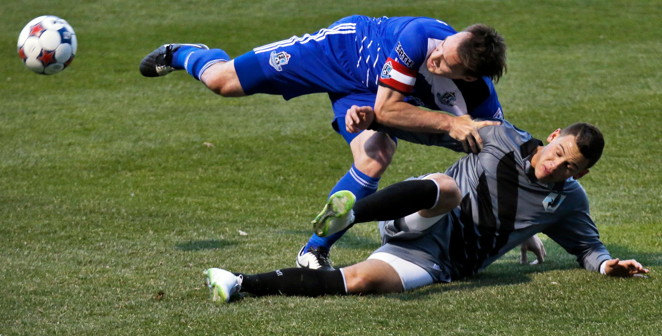 Edmonton's Albert Watson, top and United's Christian Ramirez fought for control of the ball in Minnesota's home opener. The United plays at Sporting Kansas City, an MLS team, on Wednesday.