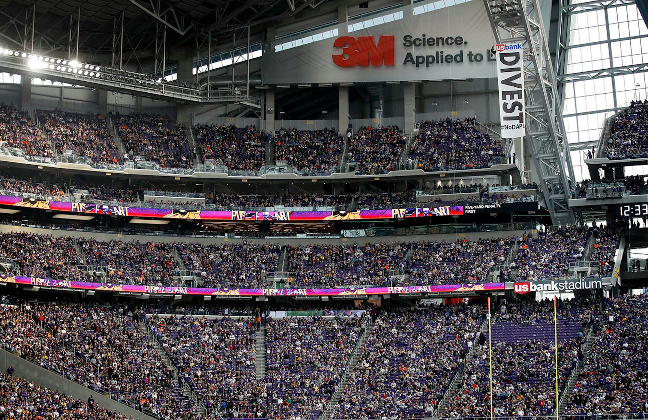 The seats directly under protesters were cleared of fans for safety reasons. #NoDAPL protesters hung a sign from the rafters of US Bank Stadium during the Minnesota Vikings vs. Chicago Bears Game.