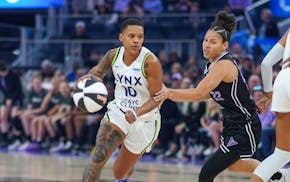 Lynx guard Courtney Williams attempts to dribble past Valkyries defender Veronica Burton on Sunday night in San Francisco.