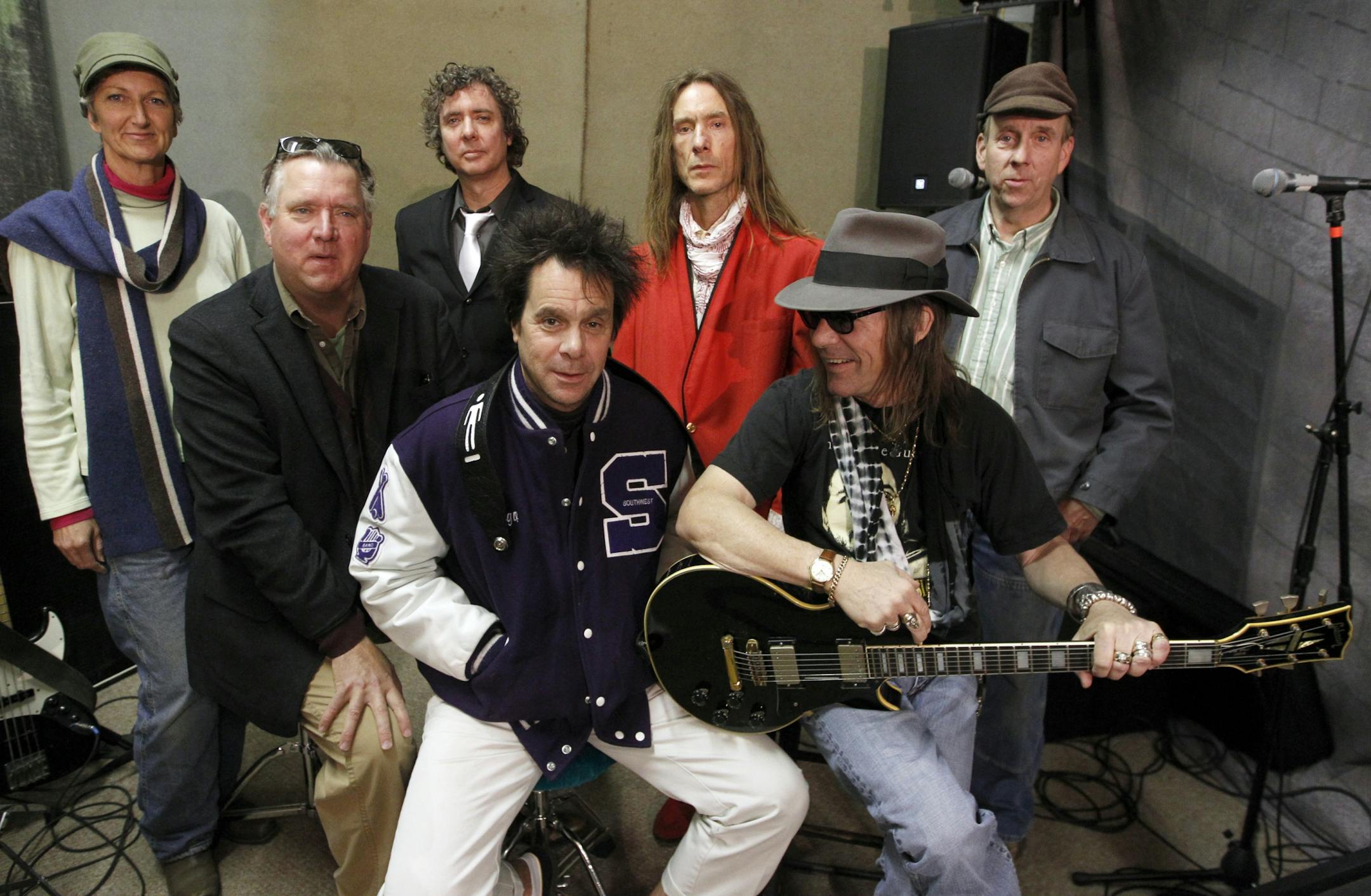 The Suburbs, from left, Rochelle Becker, Chan Poling, Michael Halliday, tie, Hugo Klaers, letter jacket, Steve Brantseg, red jacket, John "Beej" Chaney, Shades and Max Ray, back were photographed during a rehearsal last week in North Minneapolis. He and the band were getting ready for another round of Suburbs reunions, and he's back in the studio recordings for the first time in years. [ TOM WALLACE • twallace@startribune.com_ Assignment_#20020565A_ November 11, 2011 _ SLUG: burbs1118_ EXTRA INF