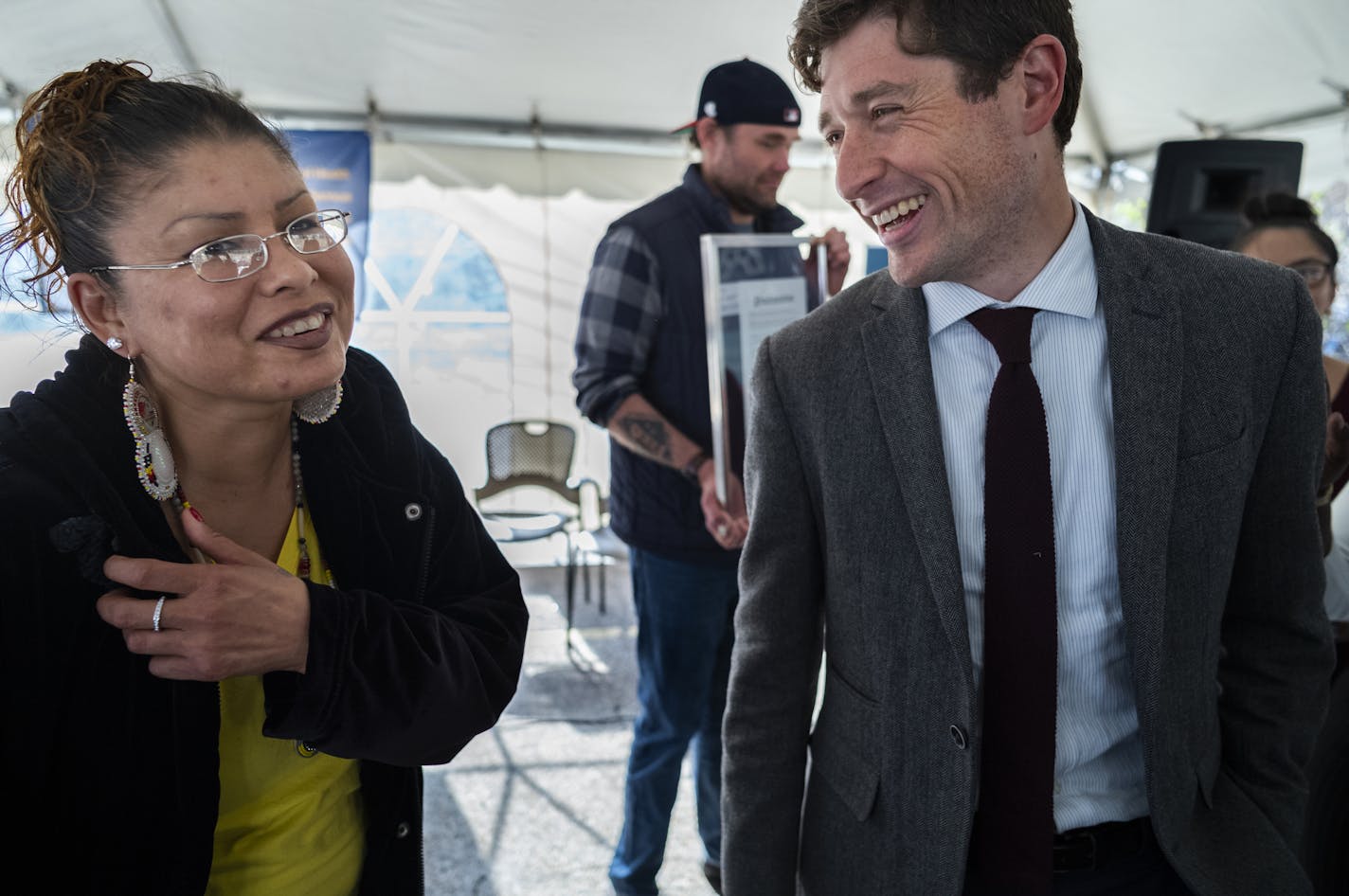 Mayor Jacob Frey congratulated Melissa Bringsthem, a former resident of the indigenous camp who has now found housing and is looking to finish her college degree.] Mayor Jacob Frey, Red Lake Nation Tribal Chairman Darrell G. Seki, Sr. and other city officials are coming together to celebrate housing 100 people previously using the Navigation Center as the city prepares to close it at the end of May. At AVIVO, Mayor Frey made a proclamation of "Red Lake Nation and Avivo Ending Homelessness Day in