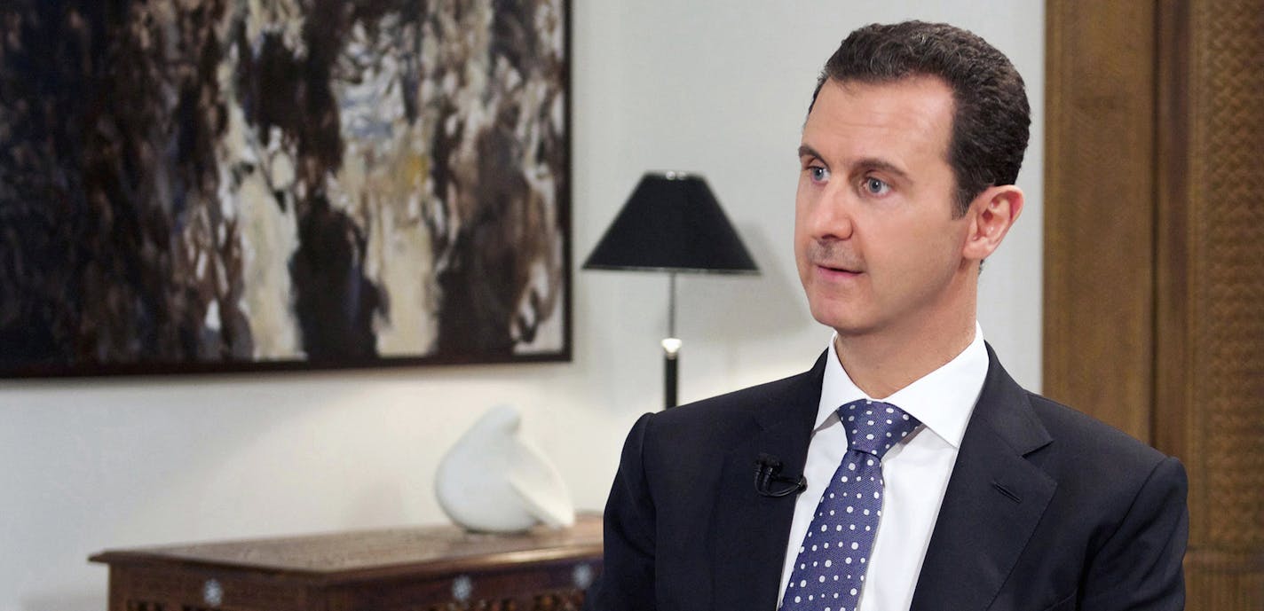 In this photo released by the Syrian official news agency SANA, shows Syrian President Bashar Assad, speaks during an interview with the Spanish news agency EFE, in Damascus, Syria, Friday, Dec. 11, 2015. The Obama administration&#xed;s best-case scenario for political transition in Syria does not foresee Assad stepping down as the country&#xed;s leader before March 2017, outlasting Barack Obama&#xed;s presidency by at least two months, according to a document obtained by The Associated Press. (